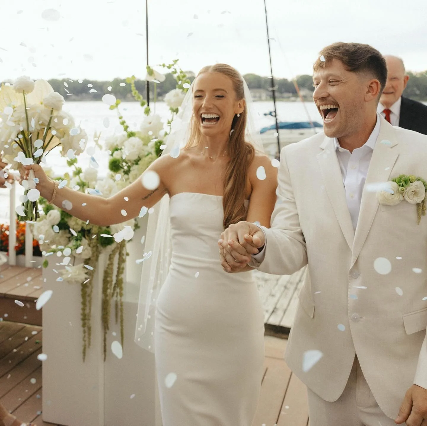 The best 30 seconds of your whole life. 💛
Hand in hand. Confetti in the air. Walking into the rest of it. If want your wedding to FEEL like this &mdash; let&rsquo;s talk. ✨
Photo: @laurensimsphoto 
Floral: @urbanallureevents x @flowersbycoll