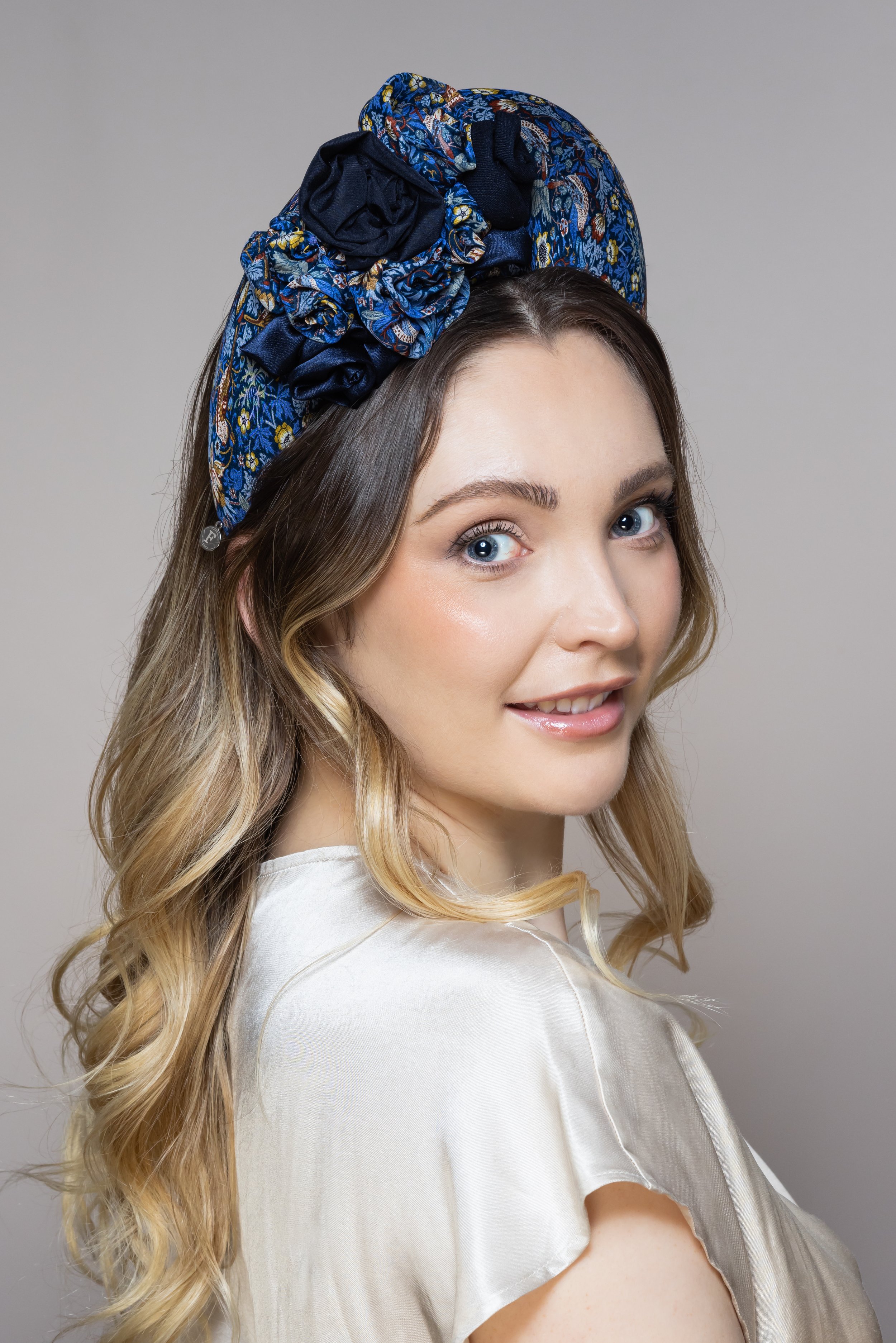 KATE halo headband with beautiful hand rolled roses in coordinating blues.