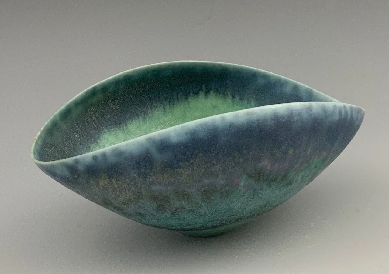 Green oval bowl  2" x 5" $200.