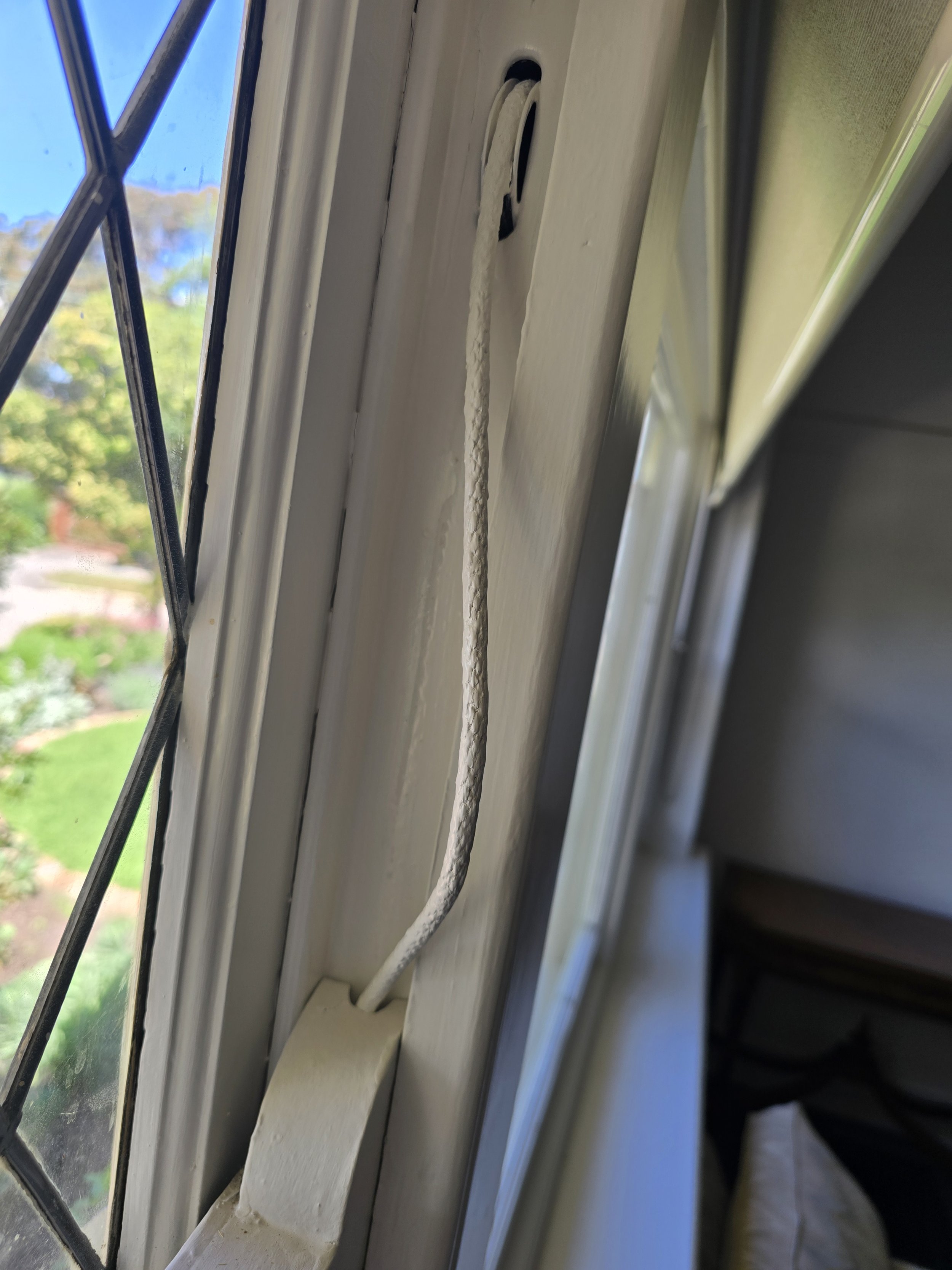 a sash cord stiff with paint