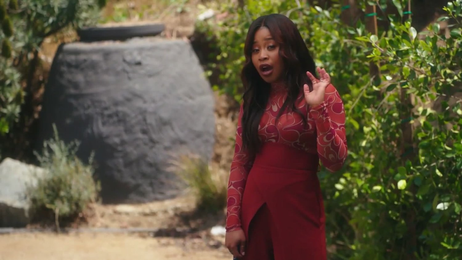 Dominique Fishback in red in a garden, from Art of the Come Up.