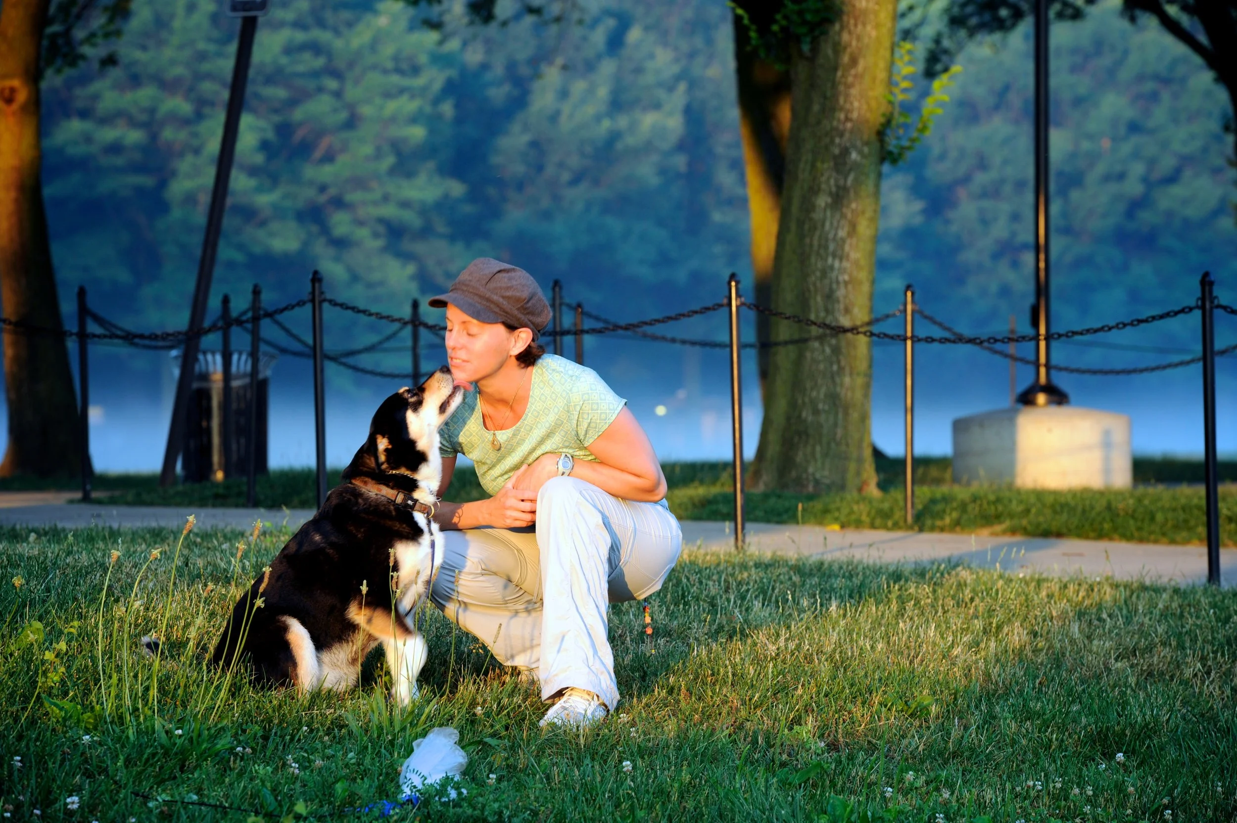 A wonam enjoying a moment with her dog