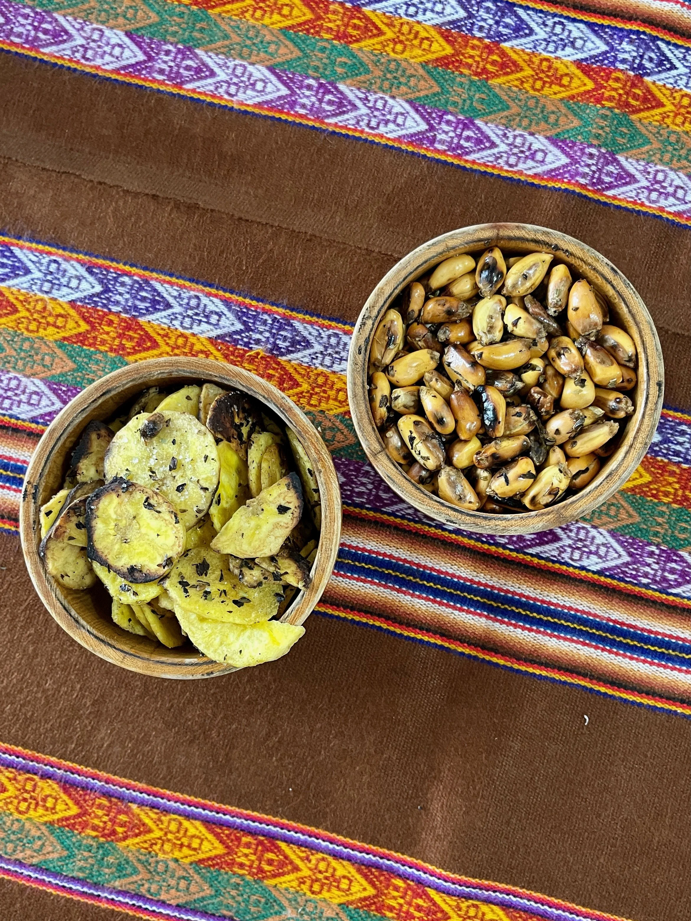 Canchita and Chifles. Local finger foods usually served with cocktails and cebiche. Think pop corn and chips.