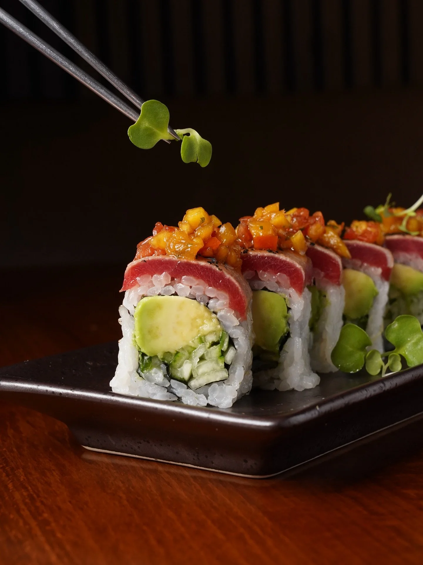 A finishing touch of microgreens for our Sam Specialty Roll. 🥢