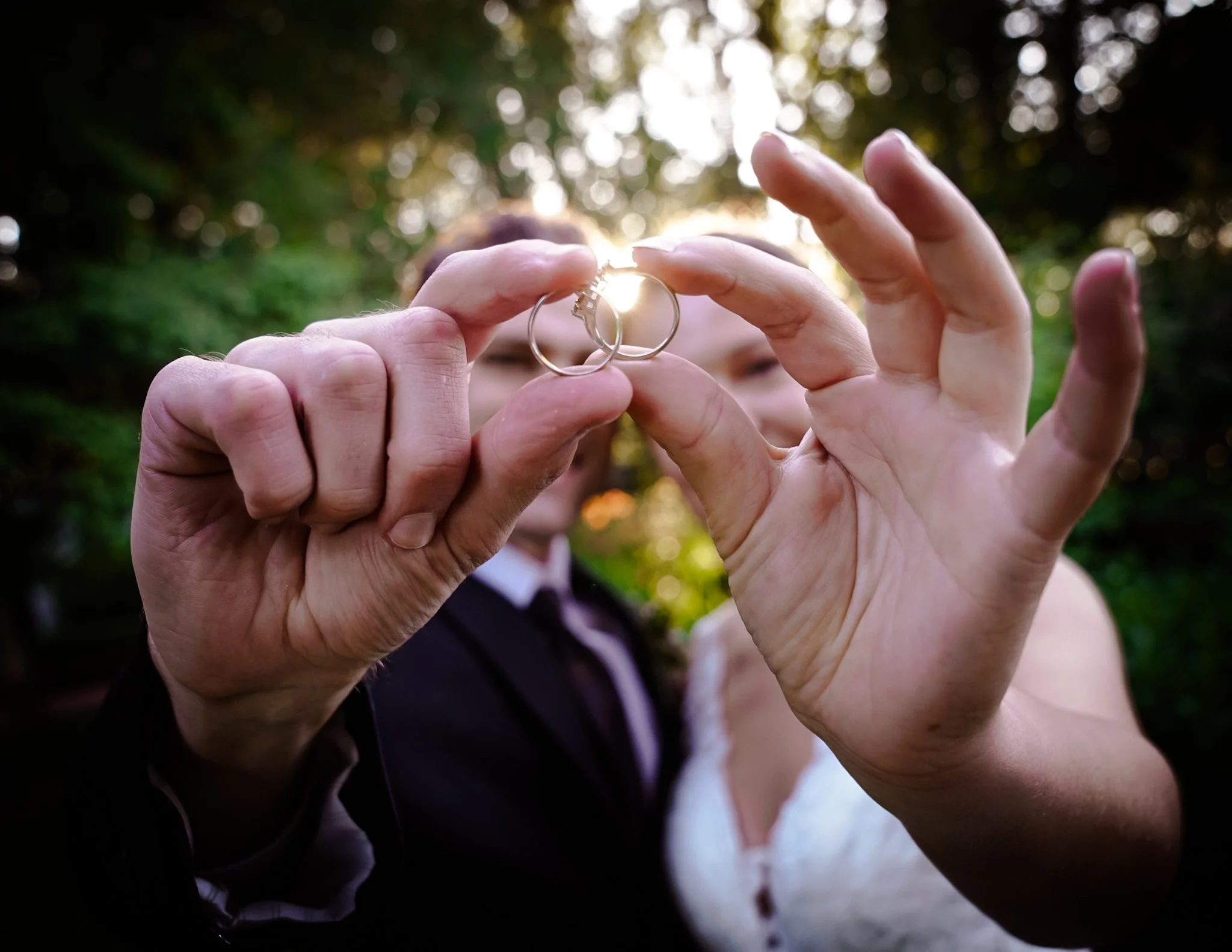 wedding rings with sunlight behind them for a wedding photo