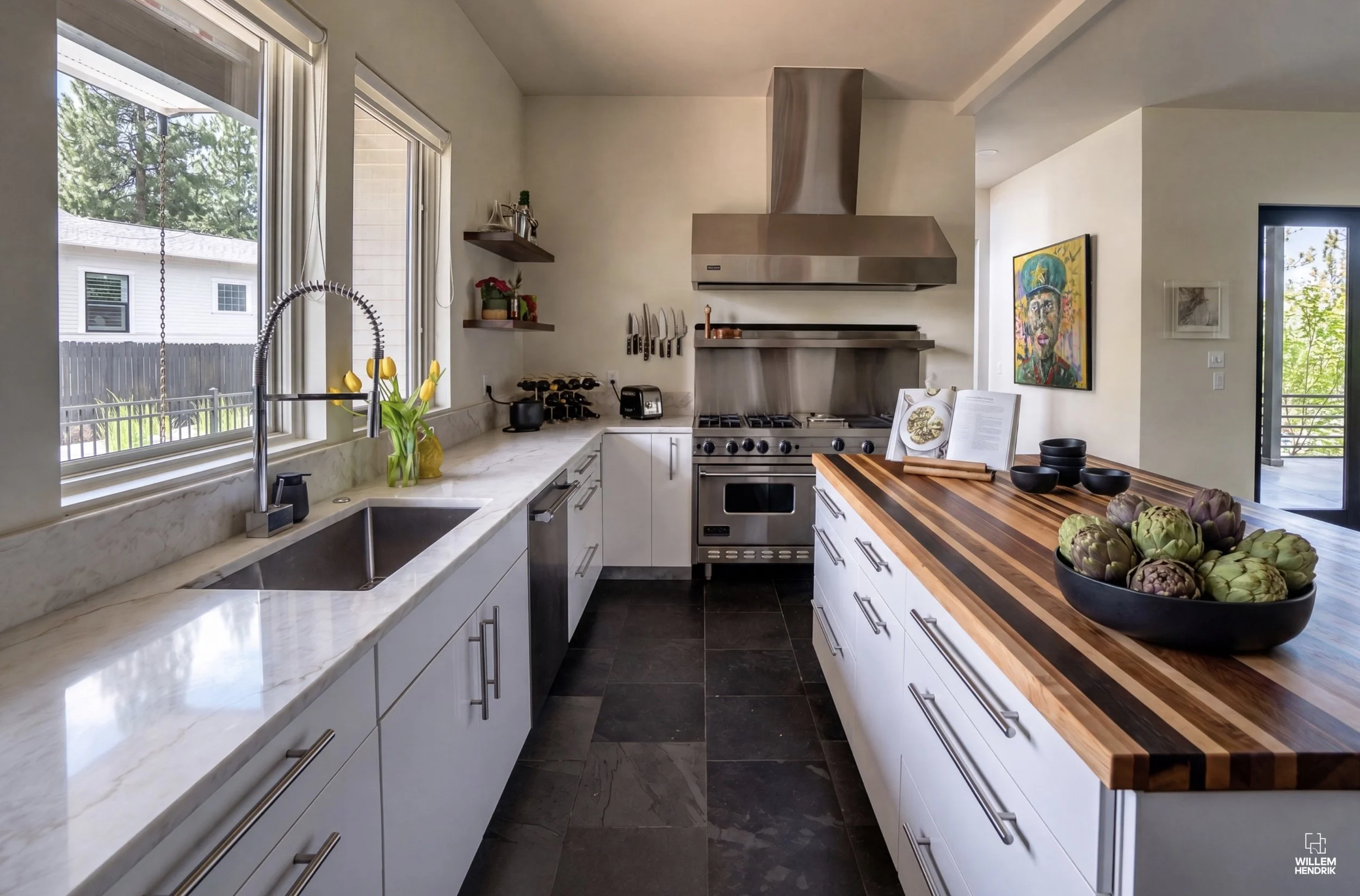 The final finished kitchen with new countertops and paint in our Discovery West Home Remodel