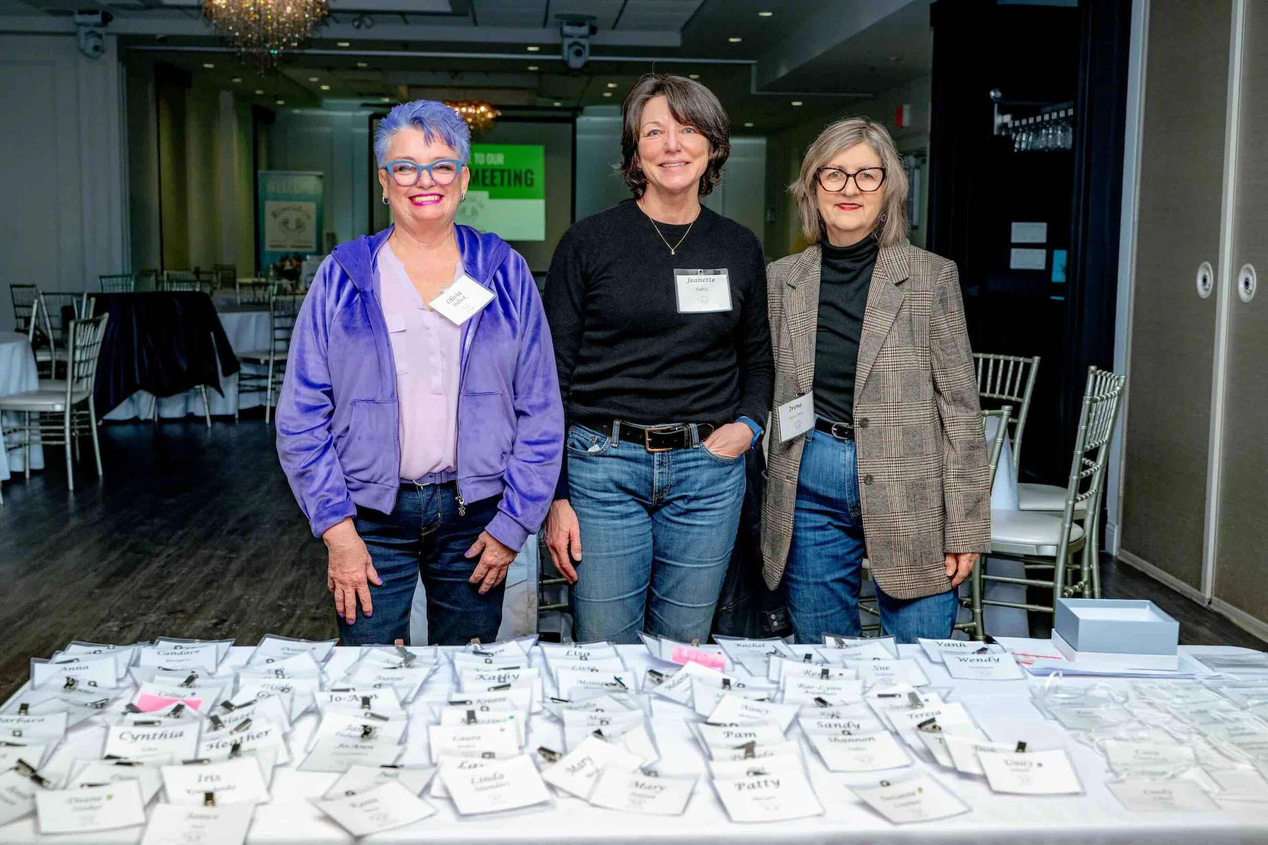 Olivia Pollock, Jeanette Fabris and Irene Glavac Petric helping with registration at 100 Women Who Care Hamilton-Wentworth's winter meeting, Carmen’s. Feb. 4.