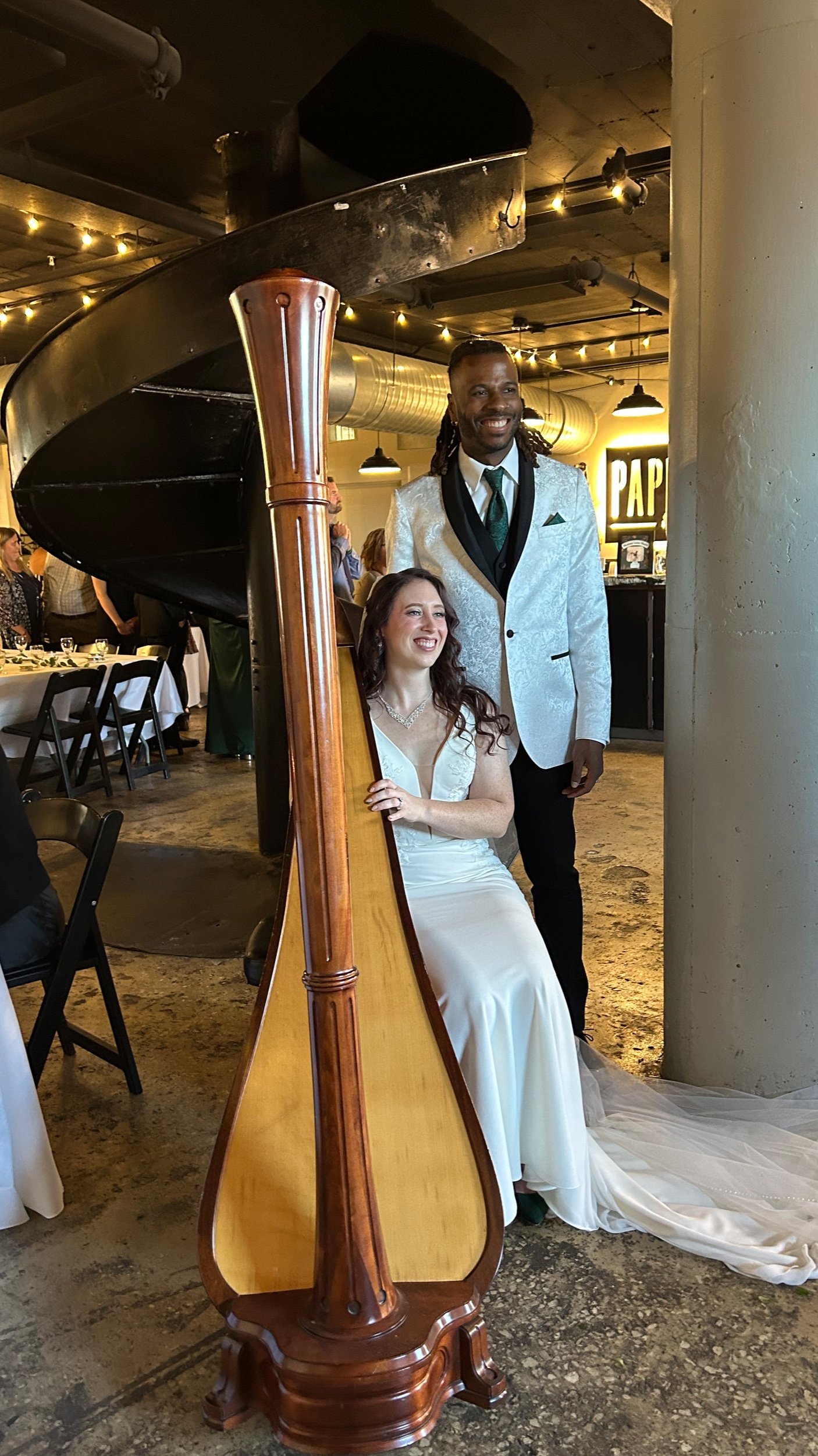 K&K posed with the harp on wedding day!