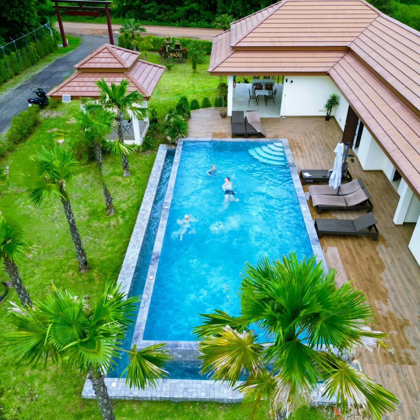 Rainy season in Isan: magic green surrounds the pool, and when it rains, just dive in!