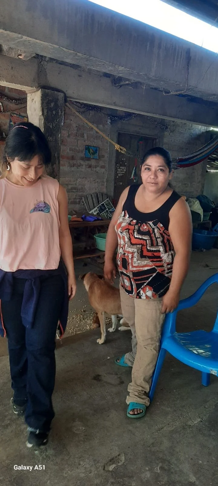 Caro Gomez standing beside her cacao teacher Doña Edit in El Salvador, honoring ancestral cacao wisdom and intergenerational knowledge