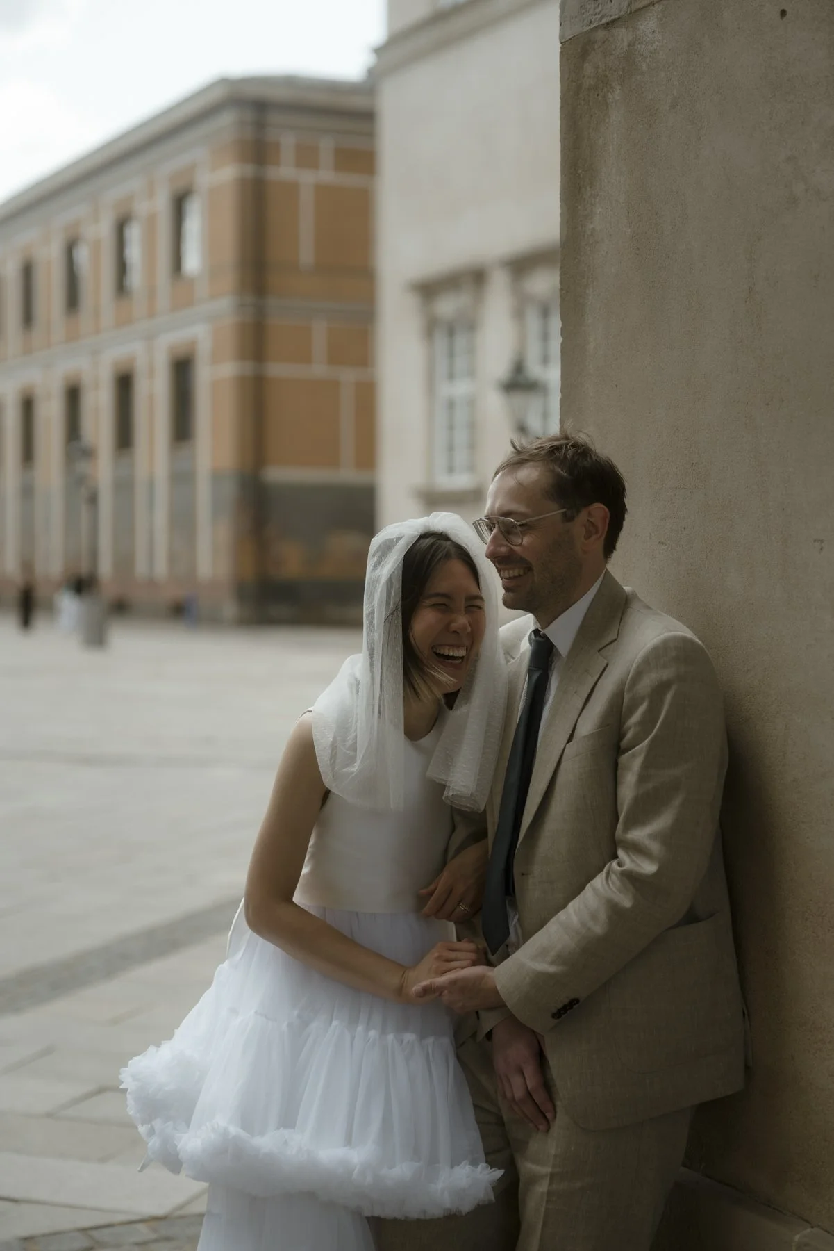 couple who just got married having a laugh in copenhagen