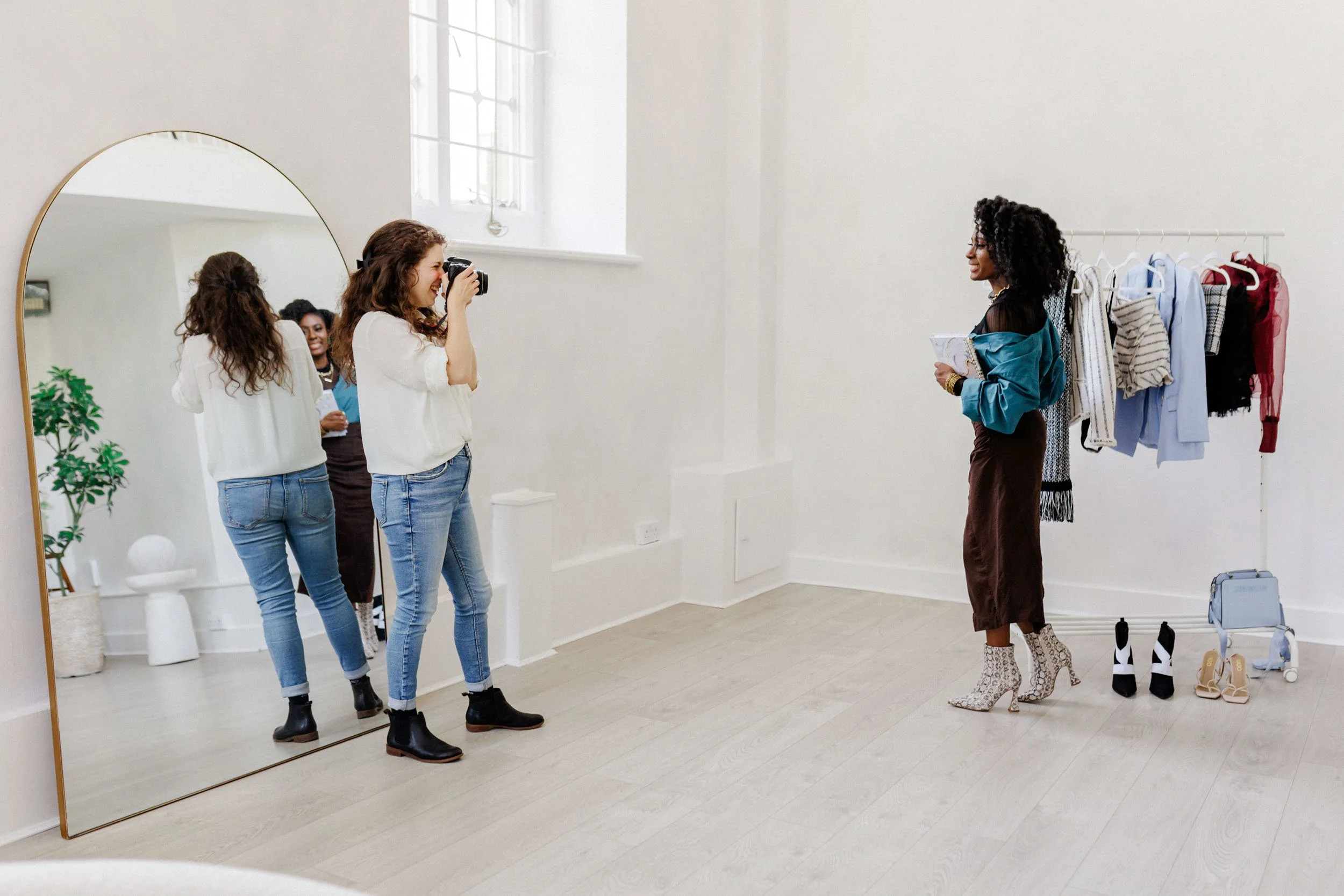Brand photographer guiding a client during a strategic brand photography and video session