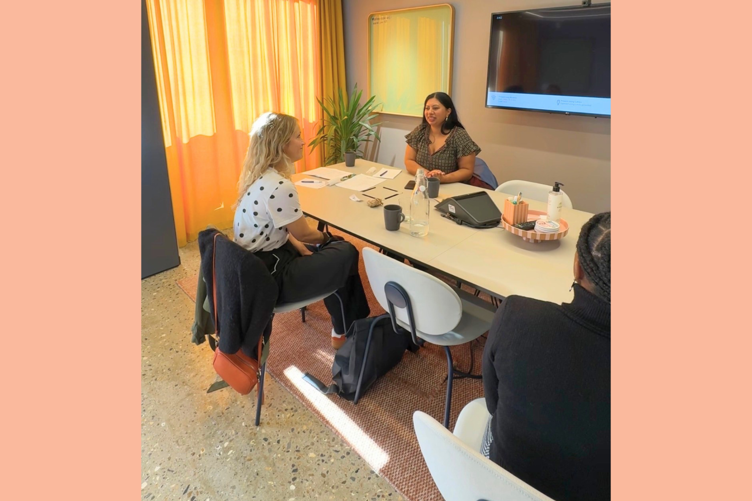 Women in business talking around a table at networking session Wood Green North London