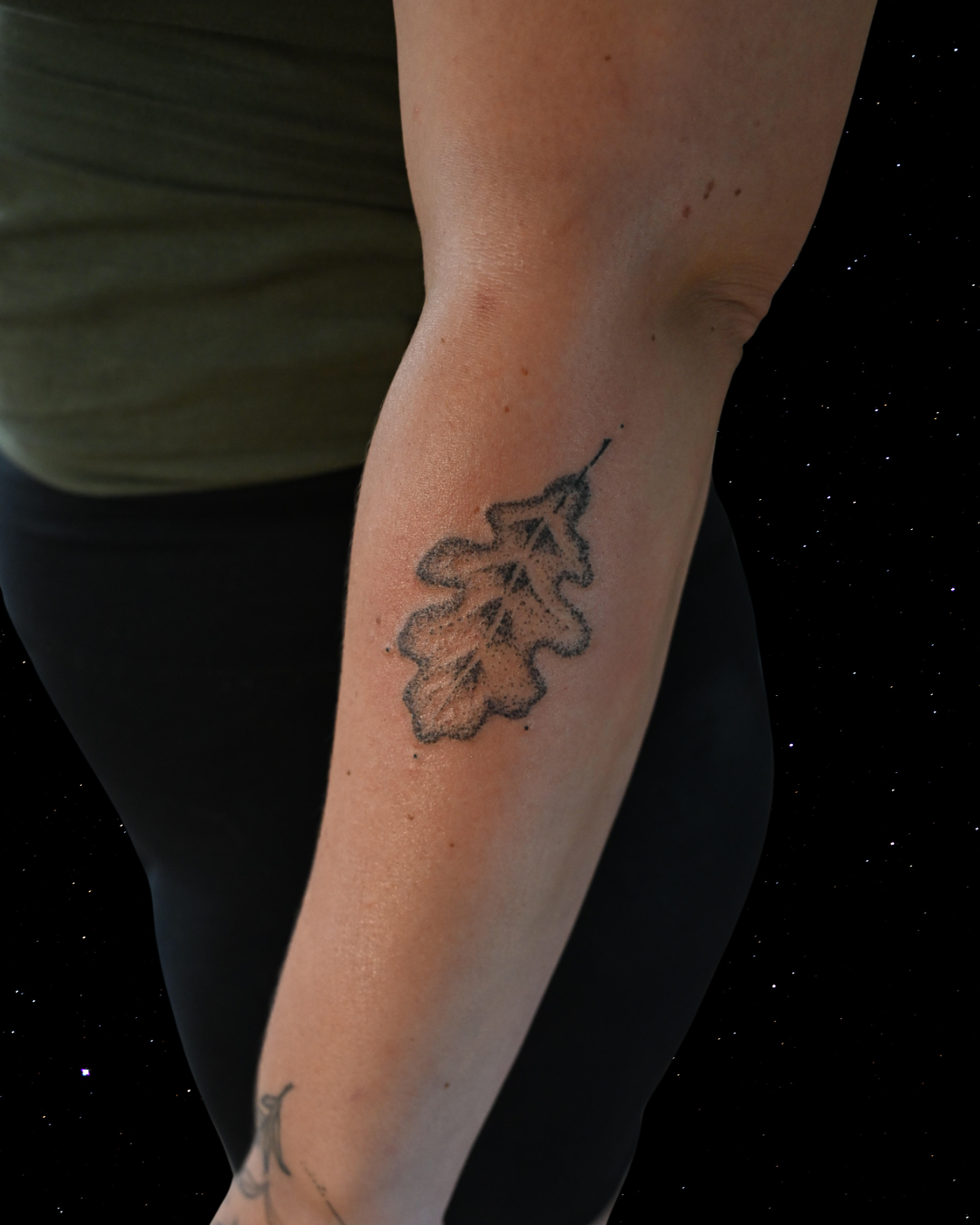Hand Poked Tattoo of a Maple Leaf on a forearm