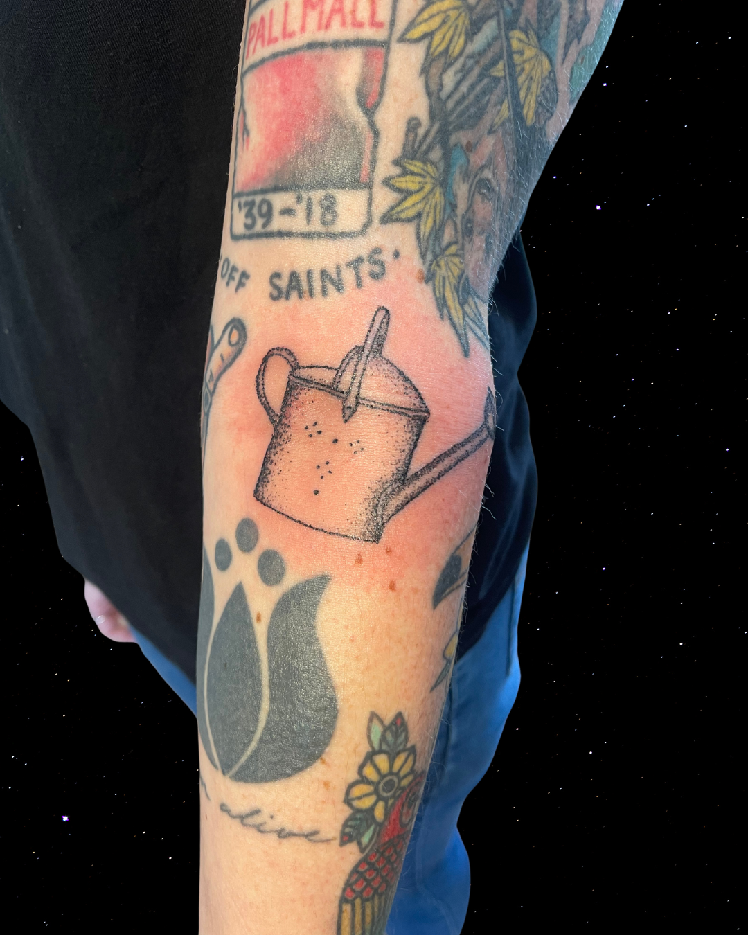 Hand Poked Tattoo of a Watering Can on someones elbow ditch