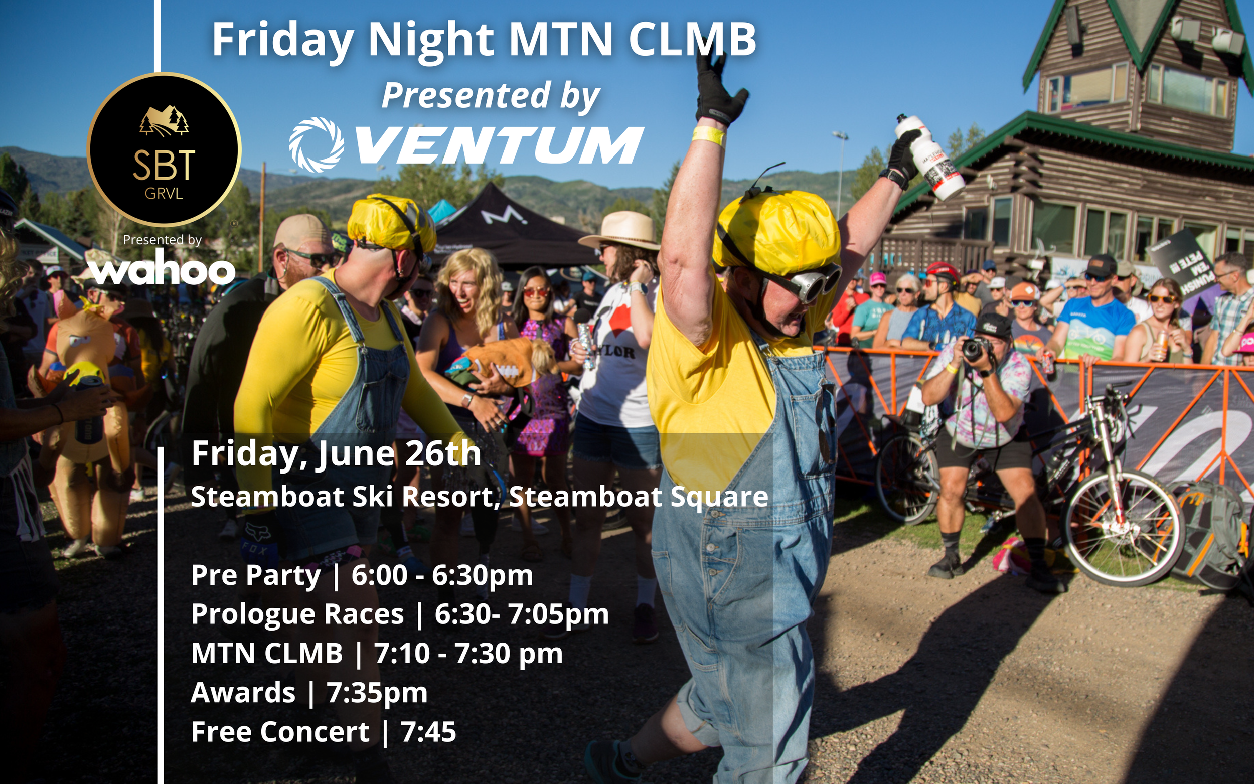 Crowd gathered at the Friday Night Mountain Biking event at Steamboat Ski Resort on June 26th. The background shows a mountainous landscape and a wooden building, with event officials and spectators, some taking photos and wearing helmets and casual clothing.