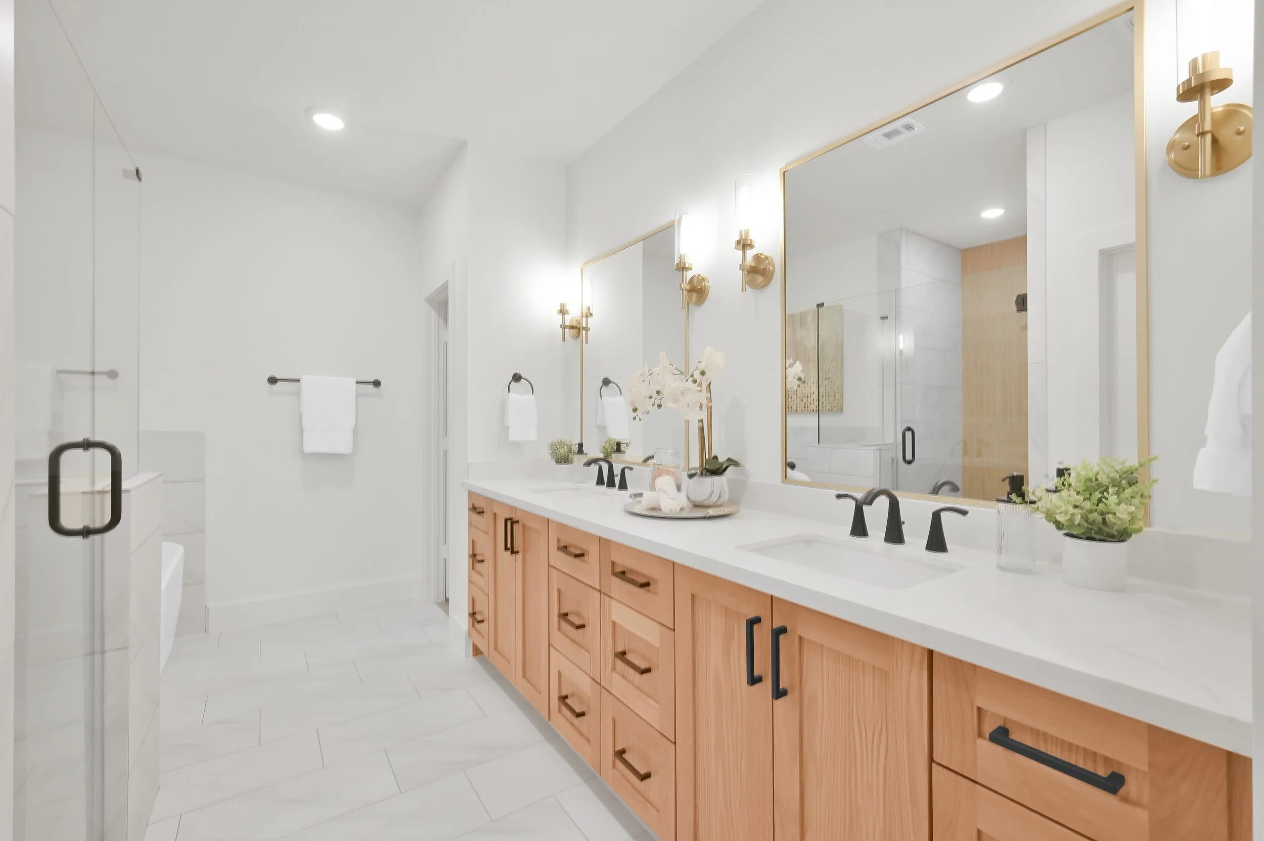 White oak custom cabinetry in primary bath.