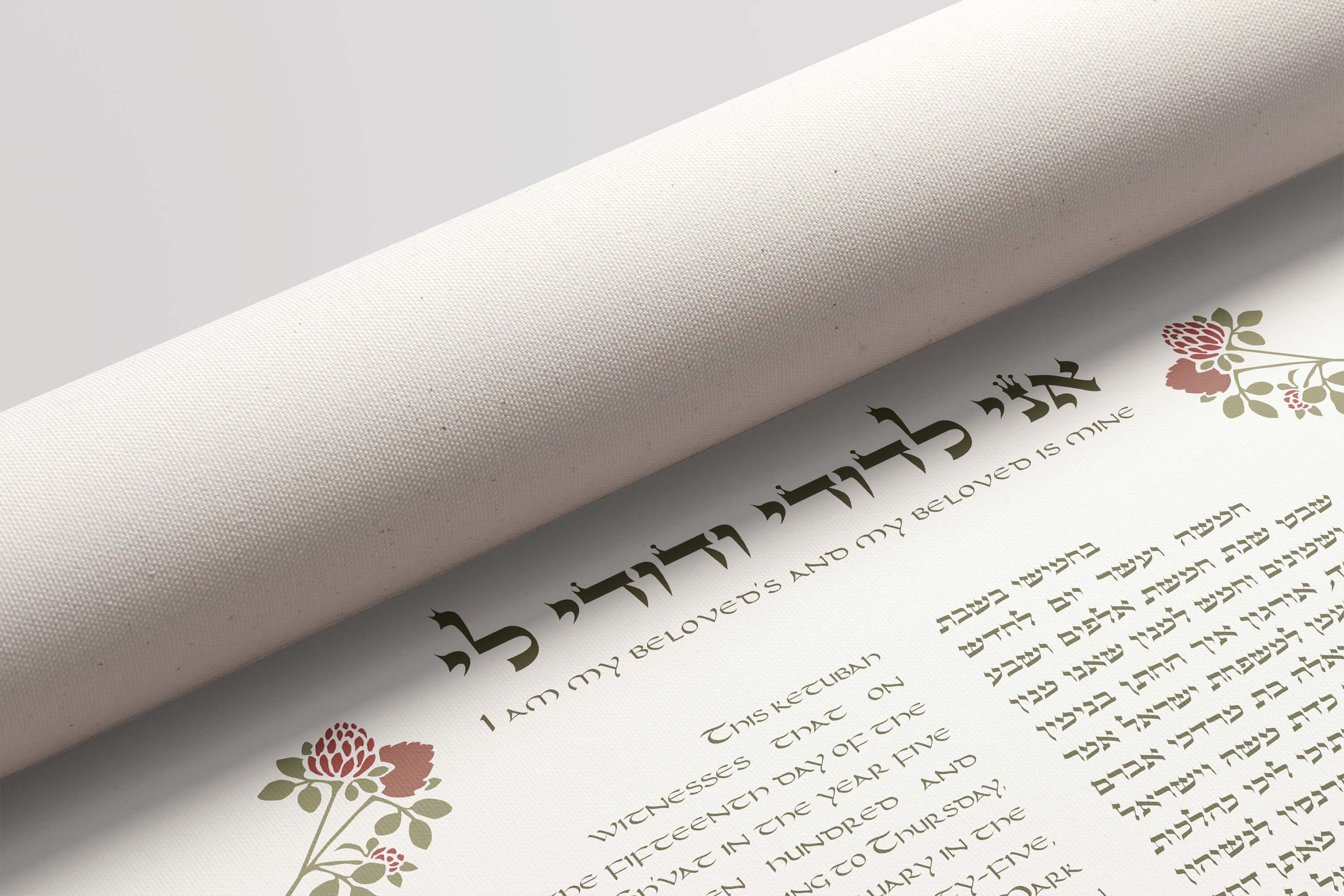 globe amaranth ketubah rolled canvas unrolling.jpg