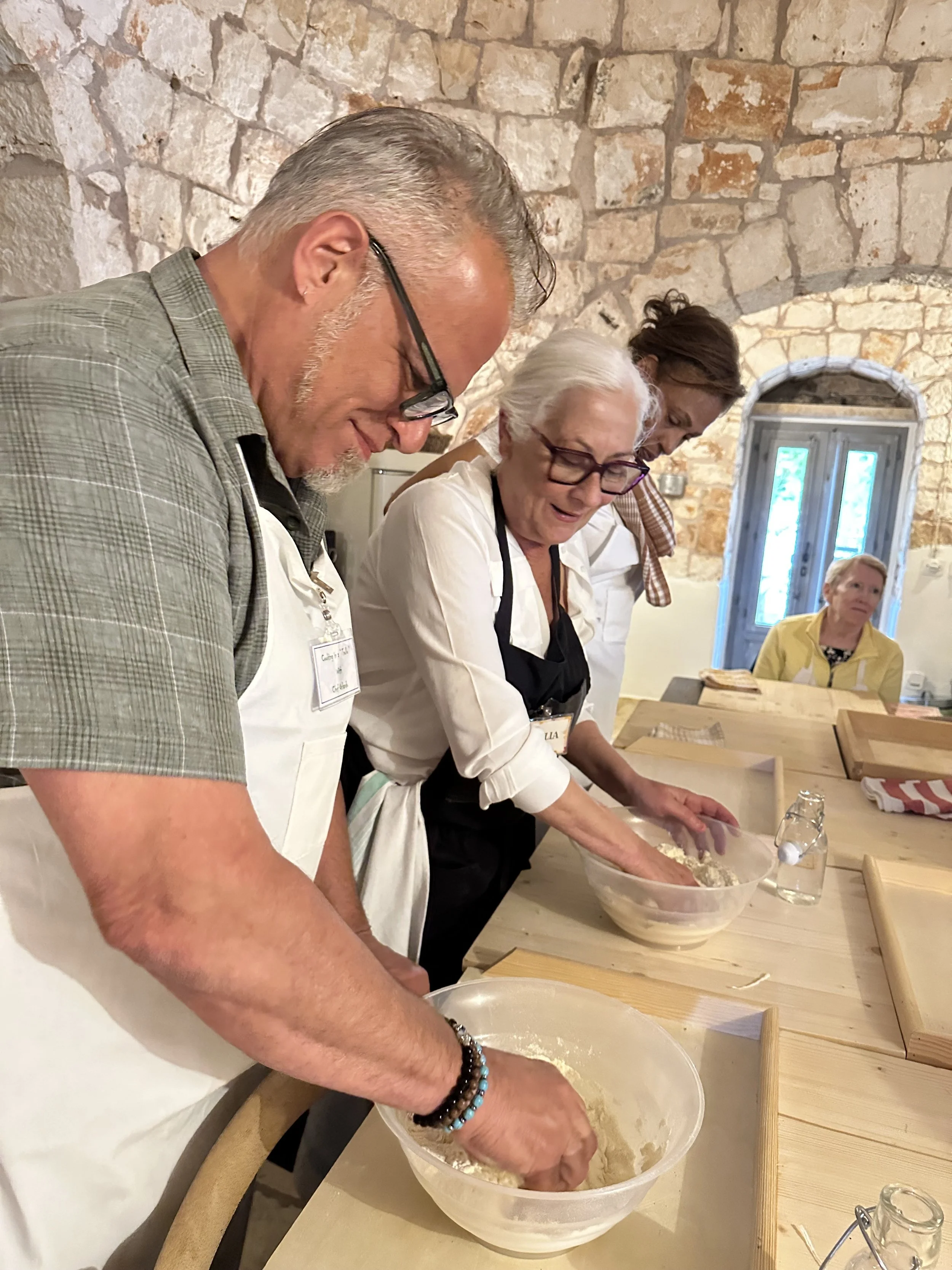 Everyone is focused on working the pasta dough