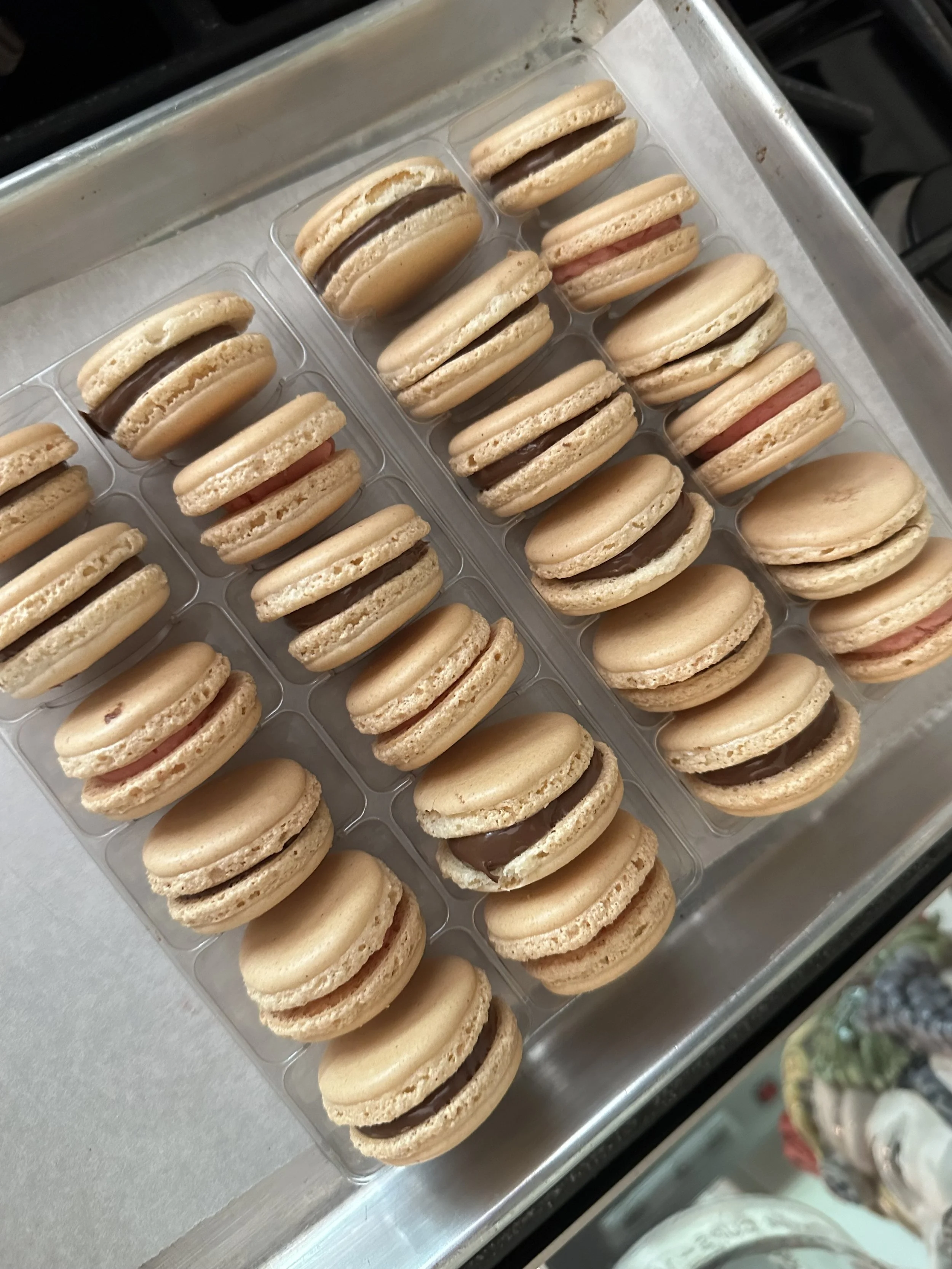 Tasty macarons with Nutella and Strawberry Buttercream filling
