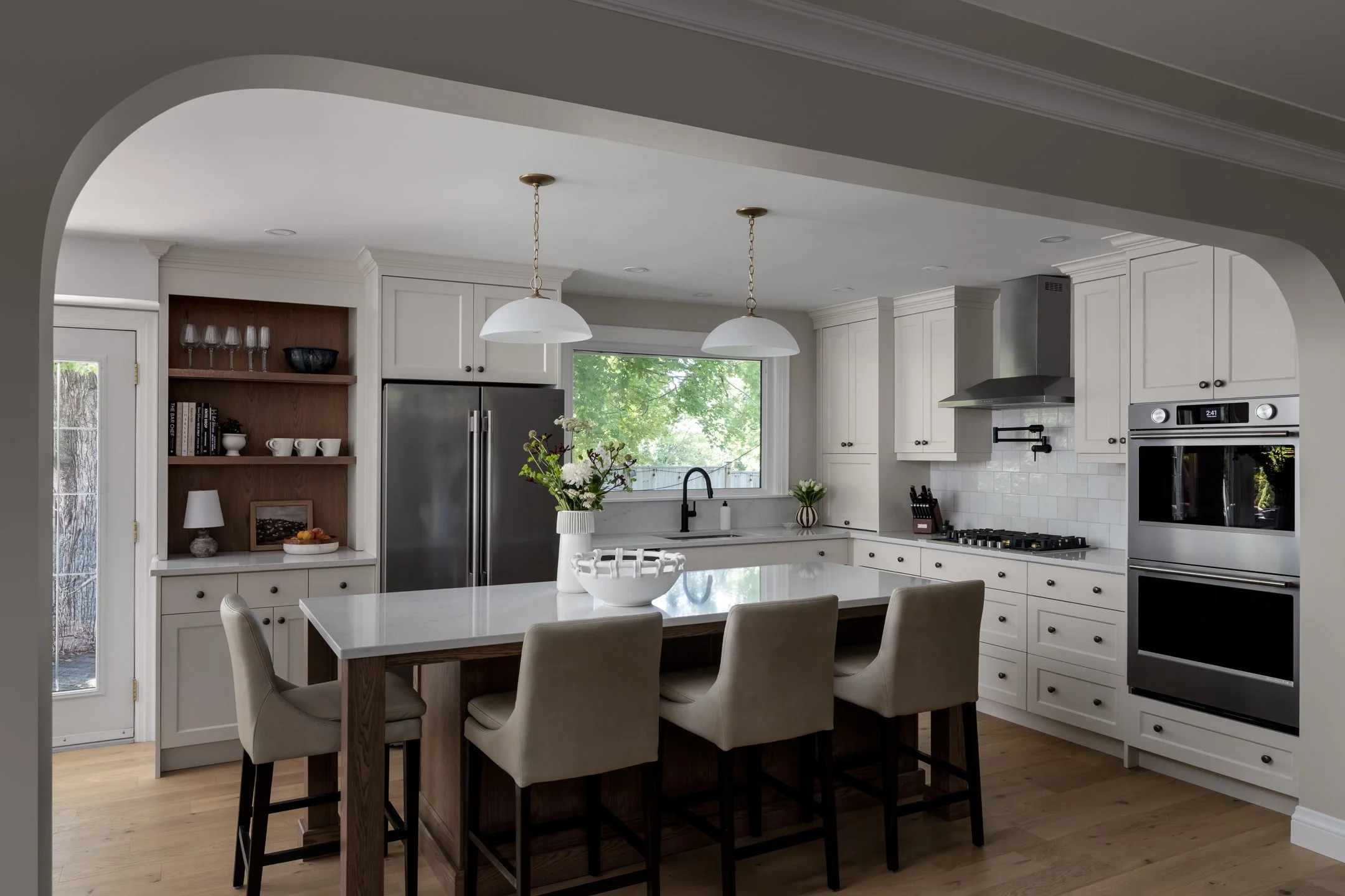 Bespoke transitional kitchen with warm wood tones and taupe cabinetry by Studio Moffatt in London, Ontario