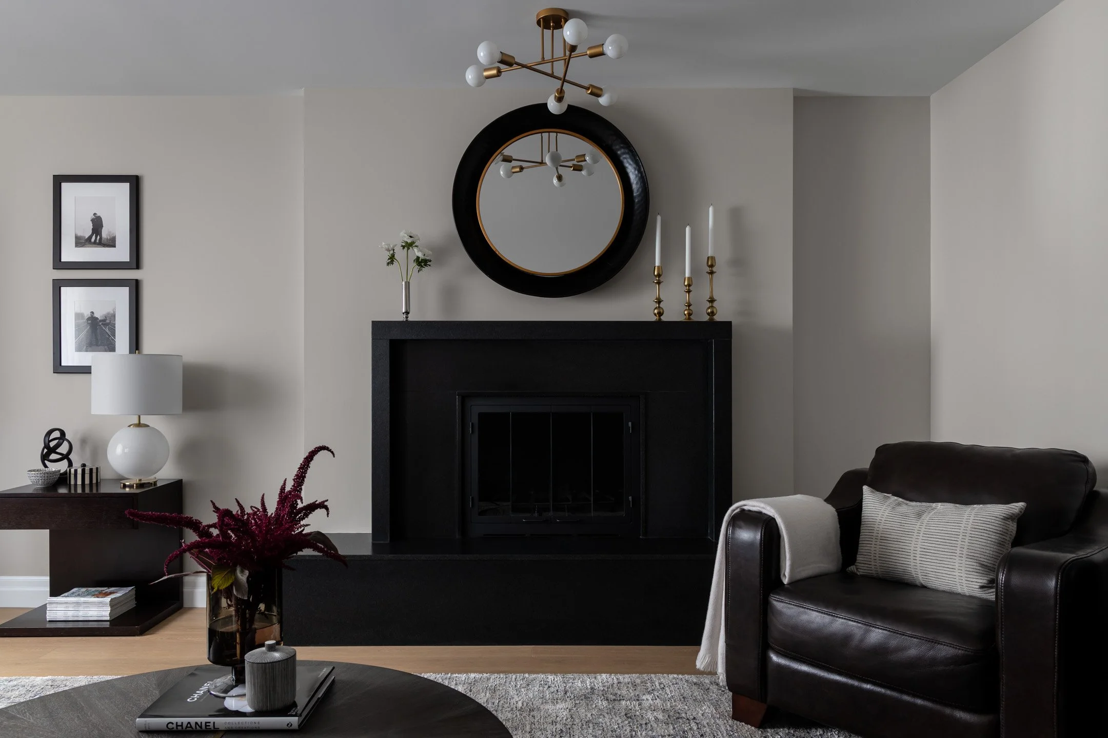 Residential renovation with wood burning fireplace upgraded with custom nero granite surround and hearth by Studio Moffatt in London, Ontario