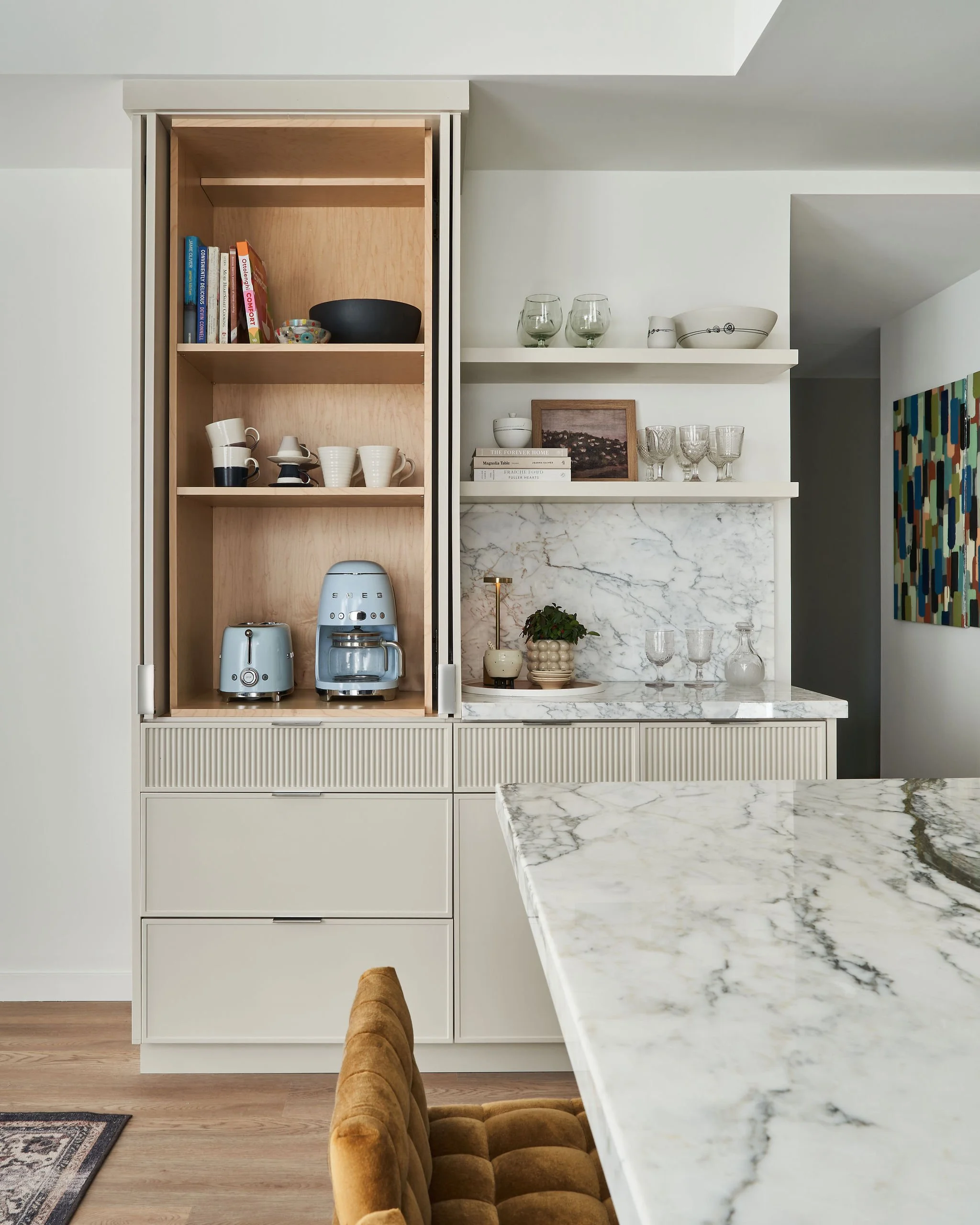 Hidden behind the cabinet doors is a functional appliance garage to store away small frequently used appliances.