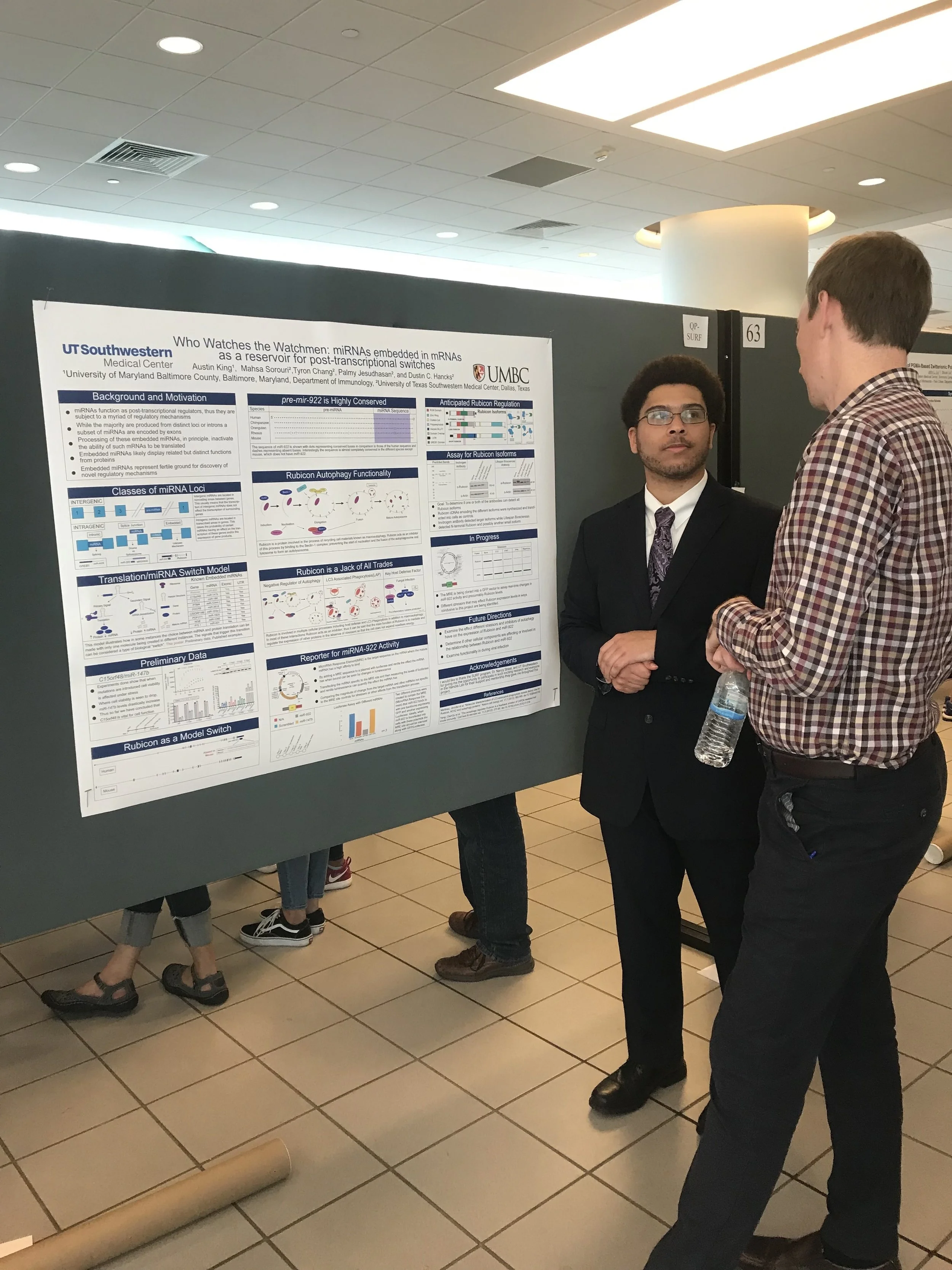 Austin chatting with Dr. Orchard about his research