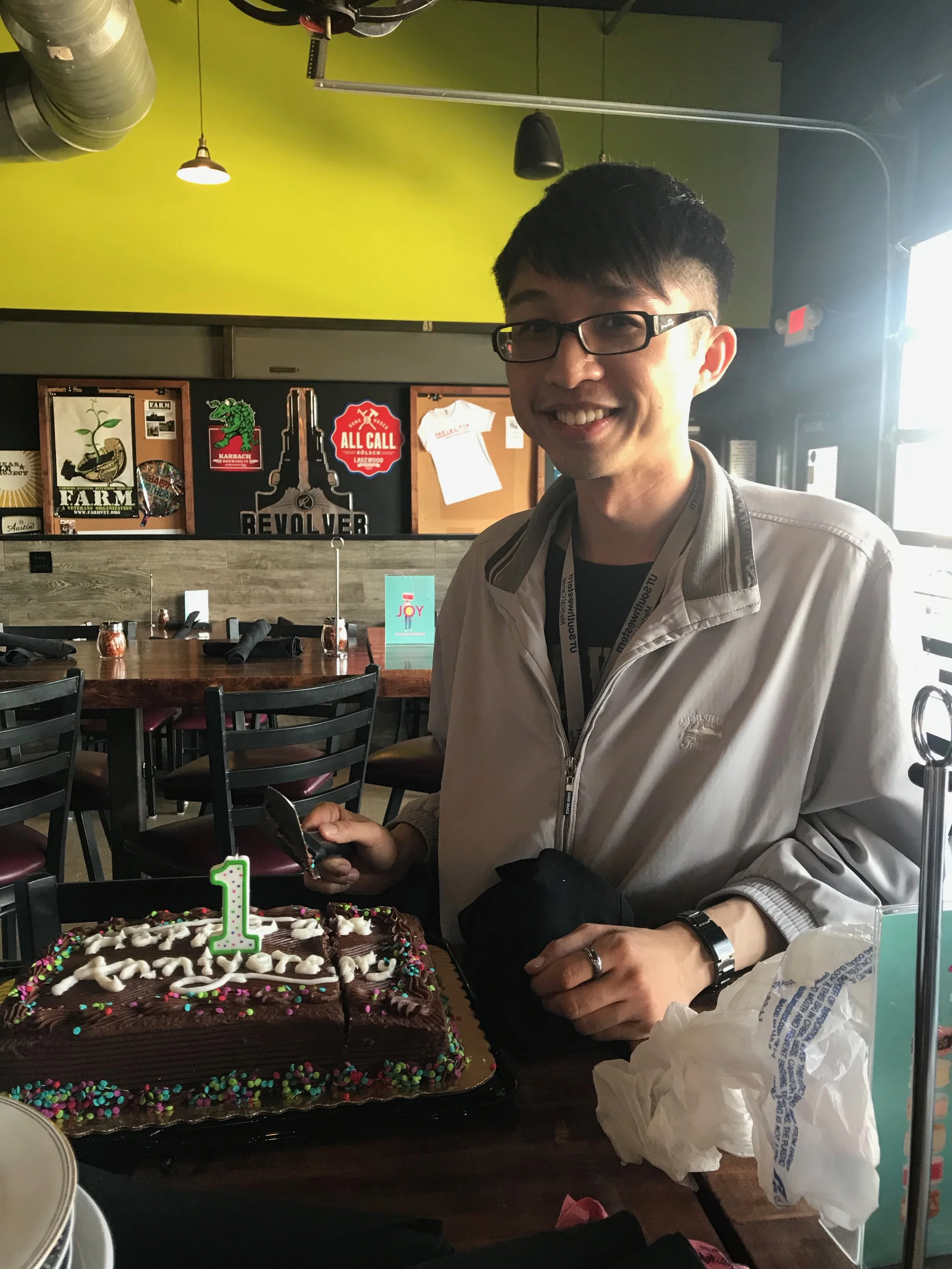 Tyron helping cut the cake