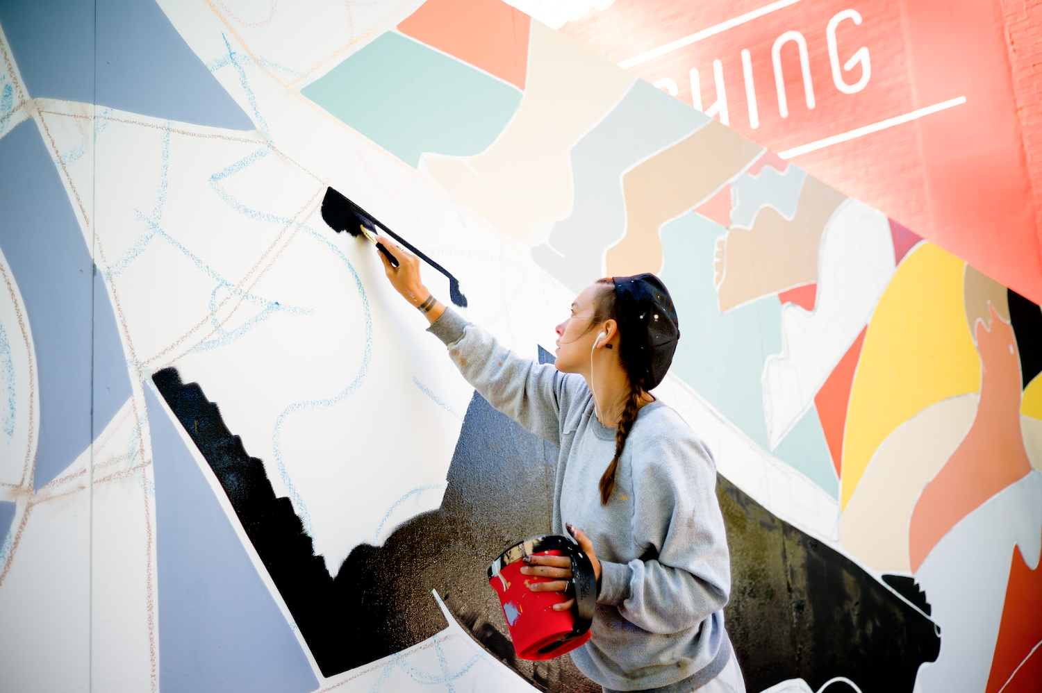 Buckley painting the Mise en Scène mural — City of San Francisco public art commission