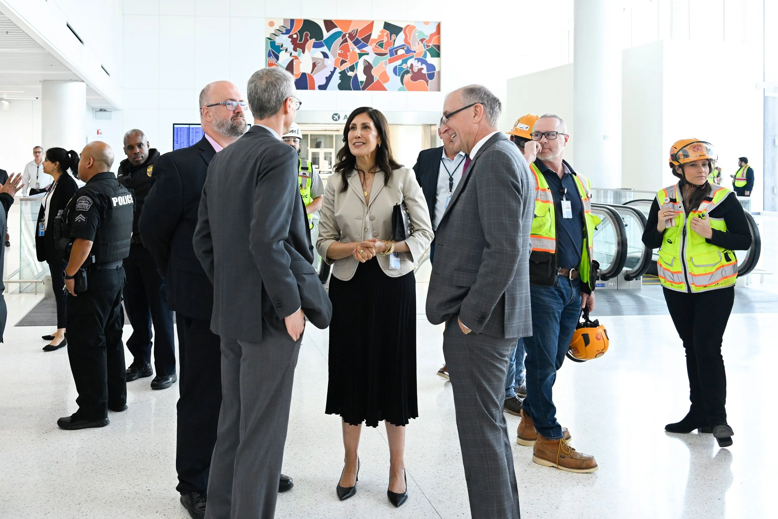 LAX Delta Terminal ribbon cutting event — Buckley mural installed in background, Los Angeles