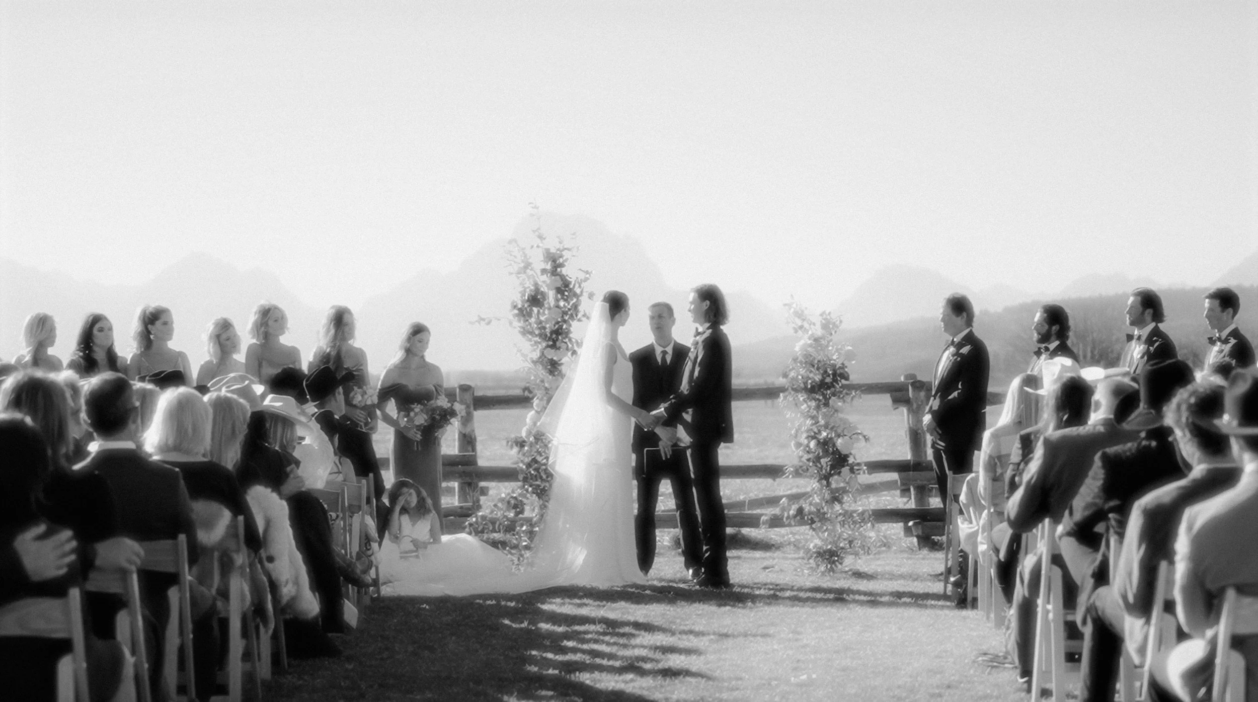 couple at their wedding in the mountains with all their family and friends