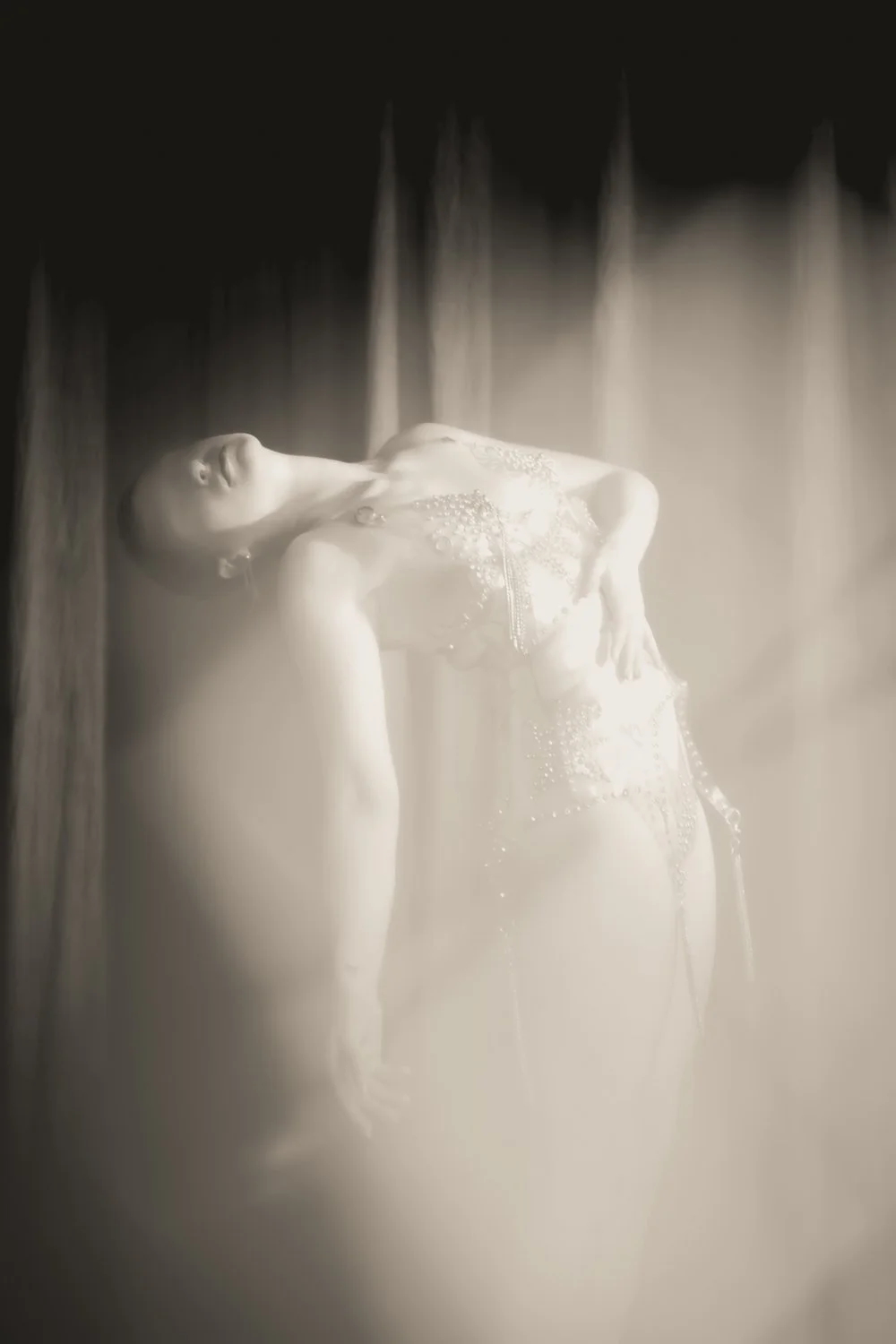 A photo of NYC Kinky Redhead Escort Julia Flowerbomb posing in diamond lingerie.