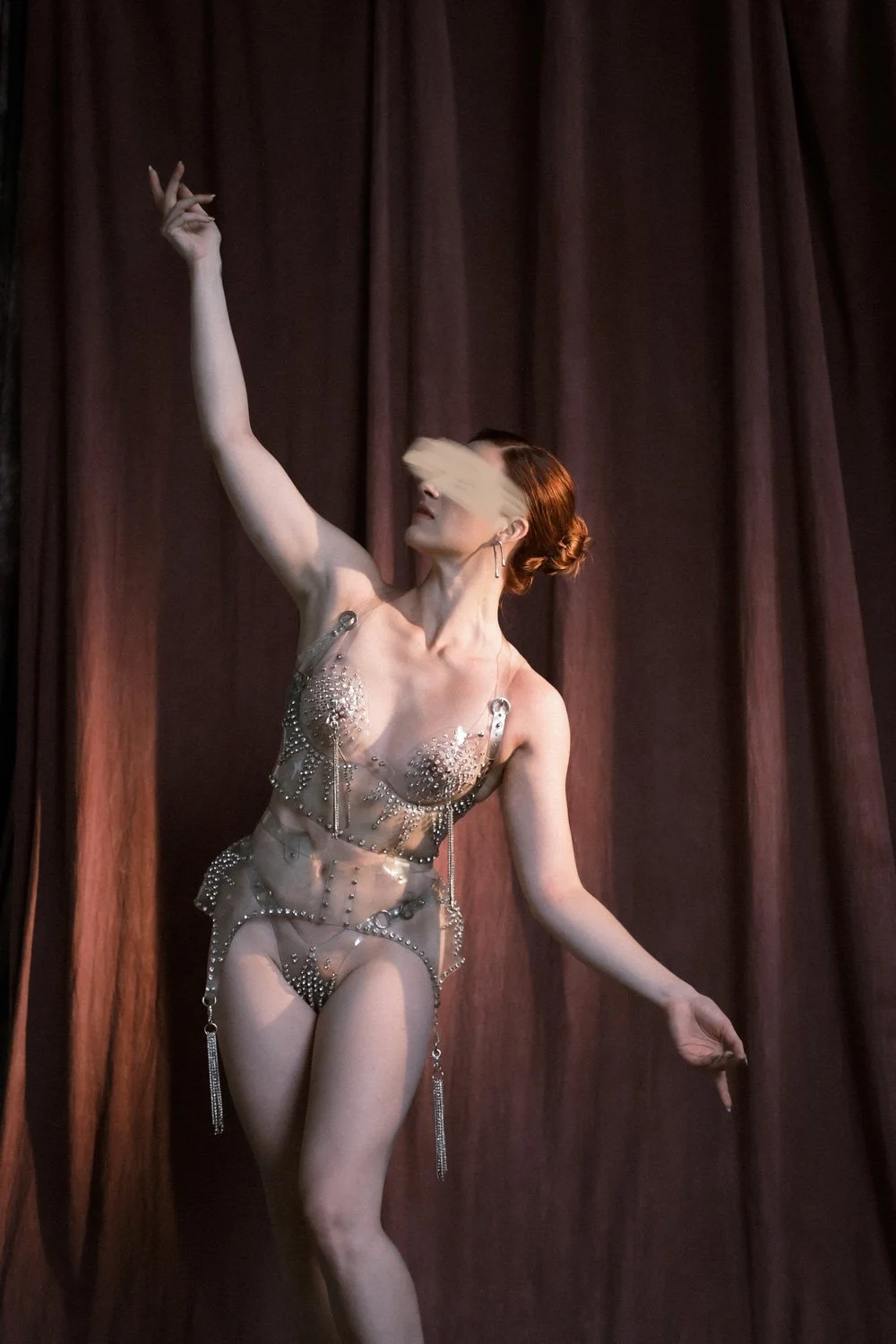 A photo of NYC Kinky Redhead Escort Julia Flowerbomb posing in diamond lingerie.