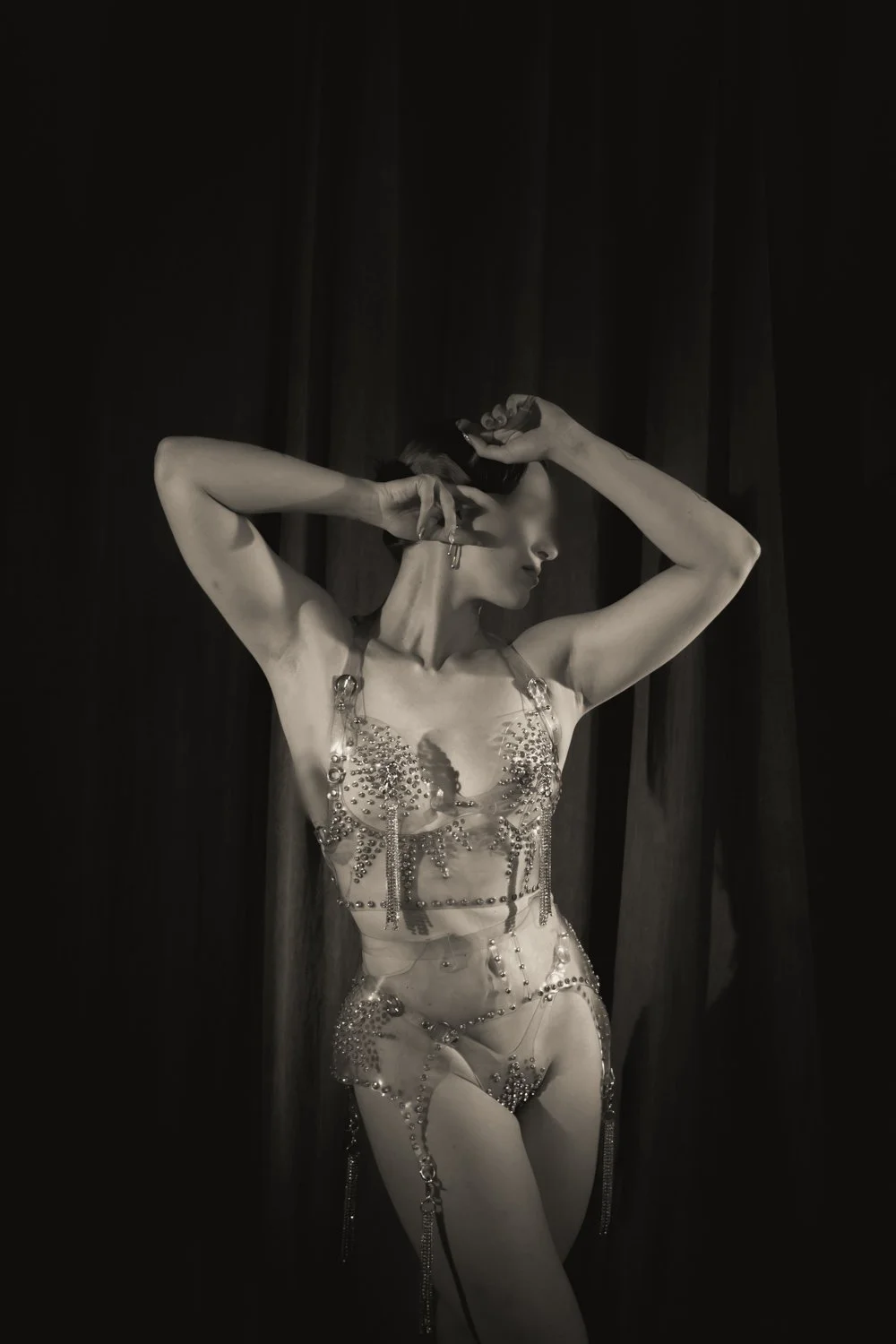 A photo of NYC Kinky Redhead Escort Julia Flowerbomb posing in diamond lingerie.