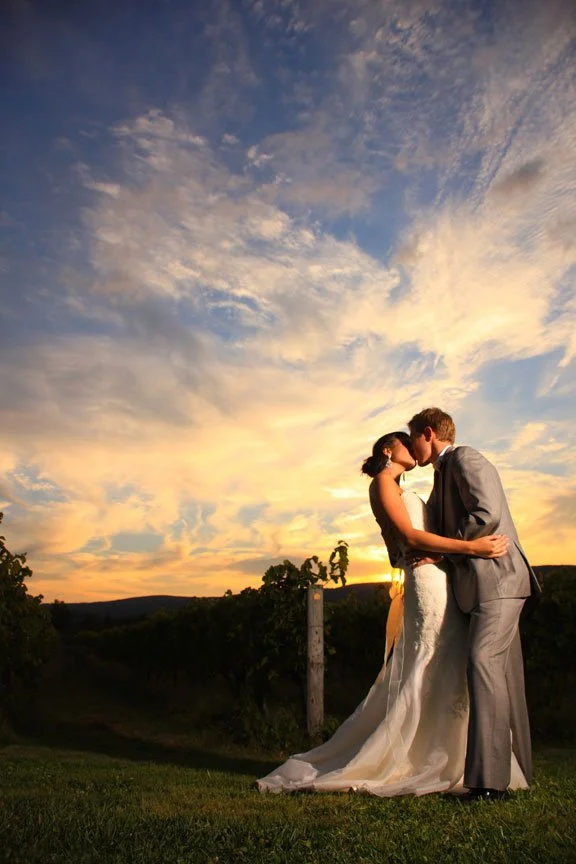 wedding review photo of couple at Breaux Vineyards at sunset