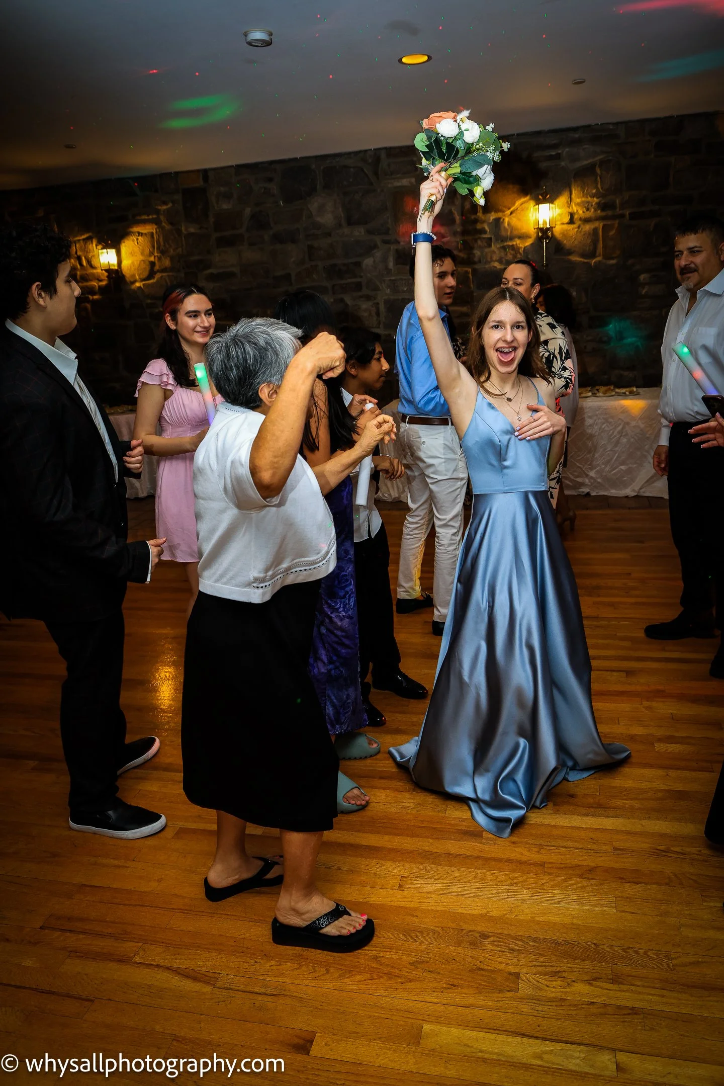 Bridesmaid catching bouquet