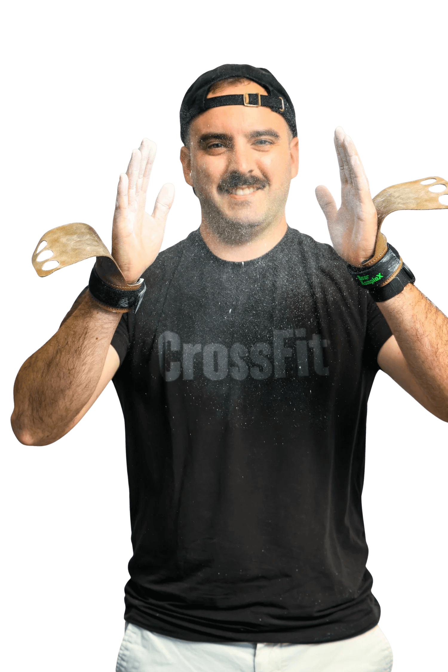 Man with a mustache and beard wearing a black cap backwards and a black CrossFit t-shirt, smiling, with foam on his face and chalk on his hands, holding wooden hand grips.
