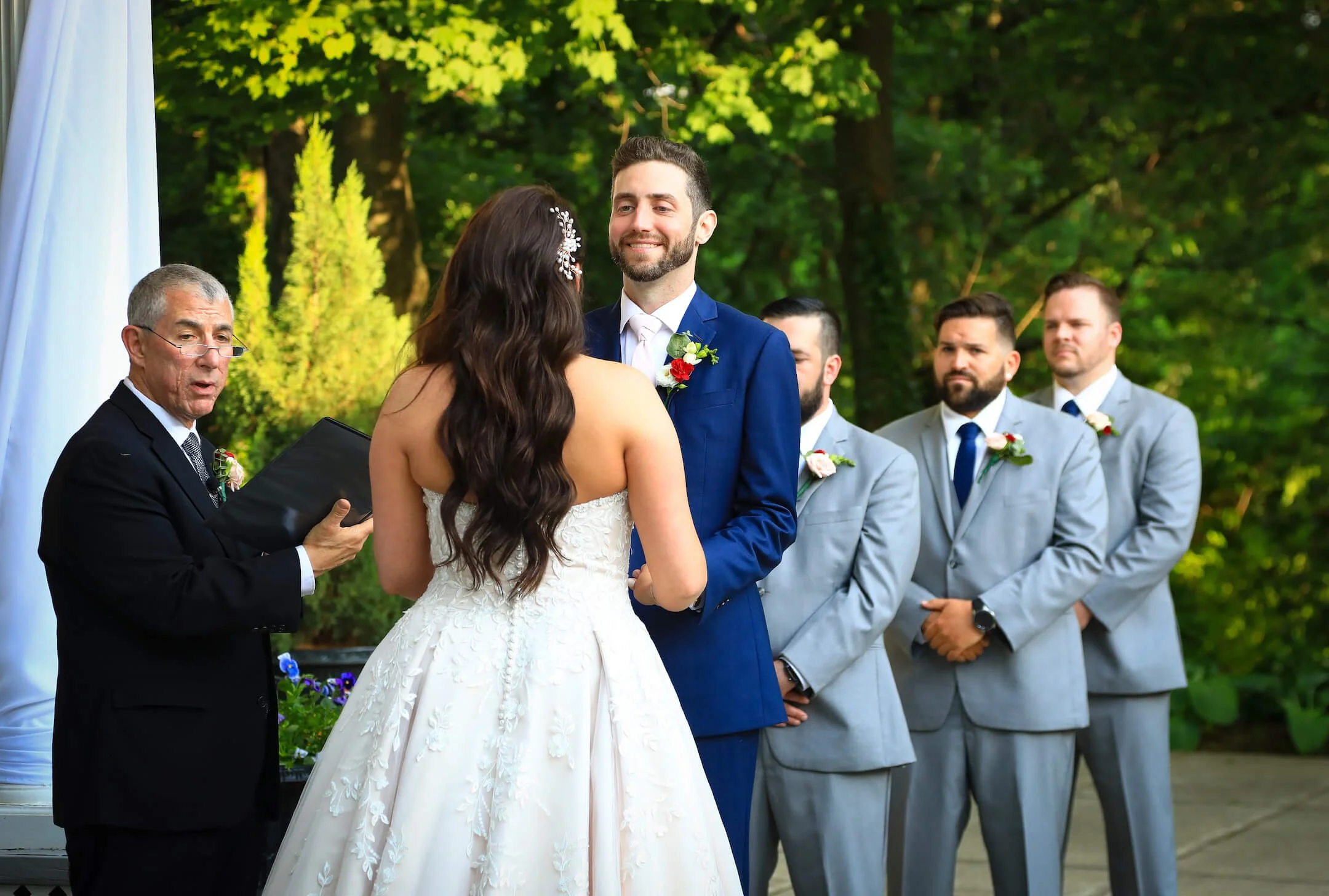 Maryland Wedding Photographer Ceresville Mansion wedding ceremony photo with groom smiling at bride