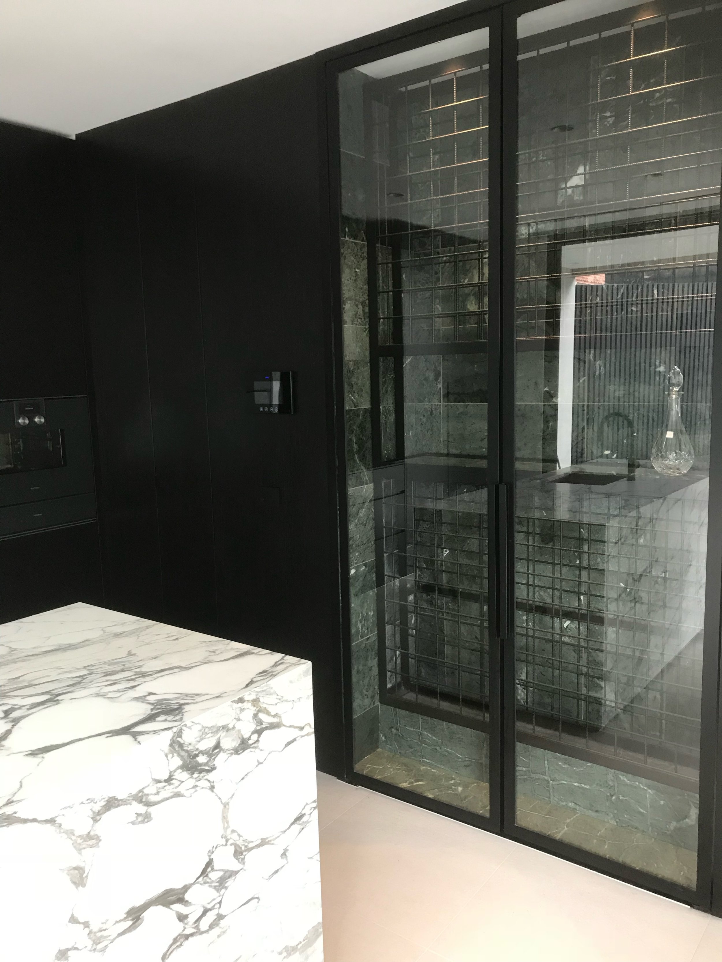 Marble bench black cabinets 1.jpg