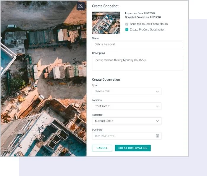 Aerial view of a construction site with multiple buildings, some under construction, next to a body of water, and an overlay of a digital form titled 'Create Snapshot' for recording an inspection related to debris removal on Roof Area 2.
