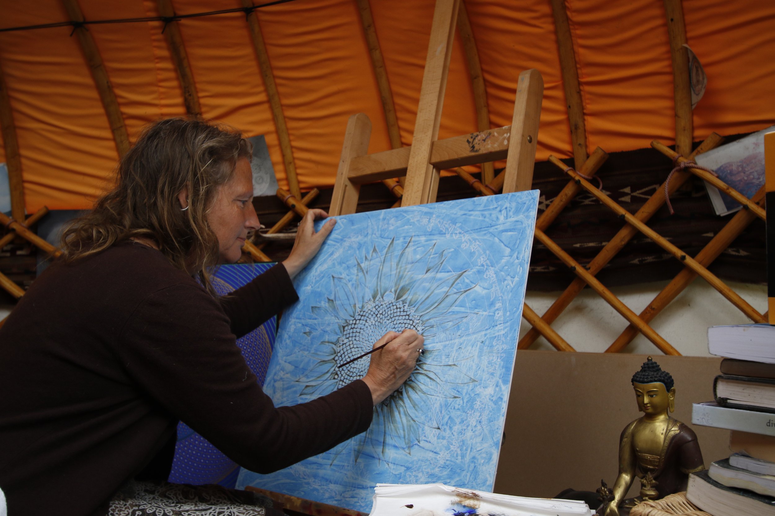 Natalie painting in yurt.JPG