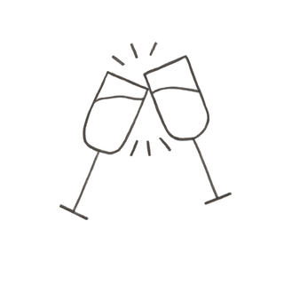 Two champagne glasses clinking together in a celebratory toast