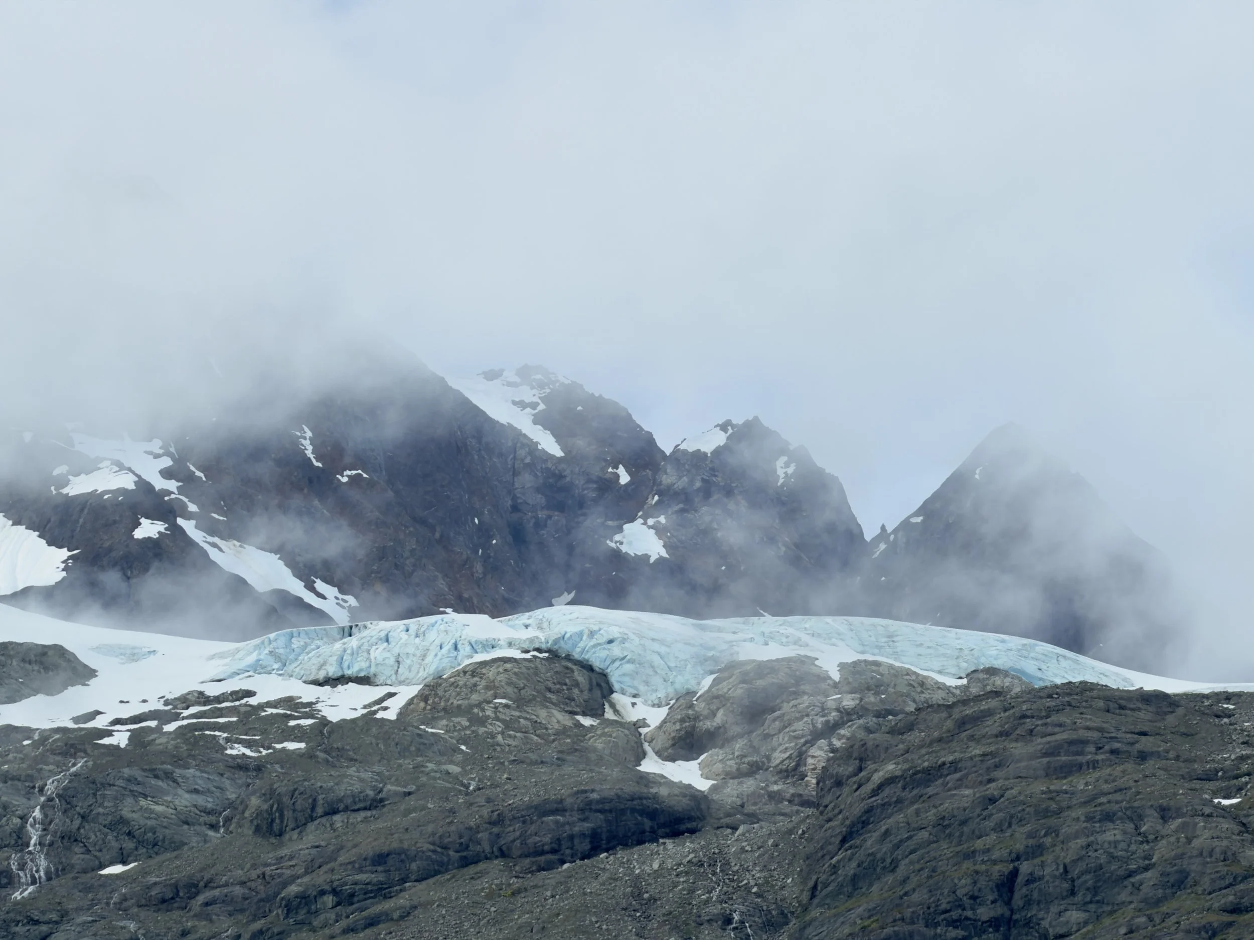  A glacier nestled in the mountains at Glacier Bay National Park 