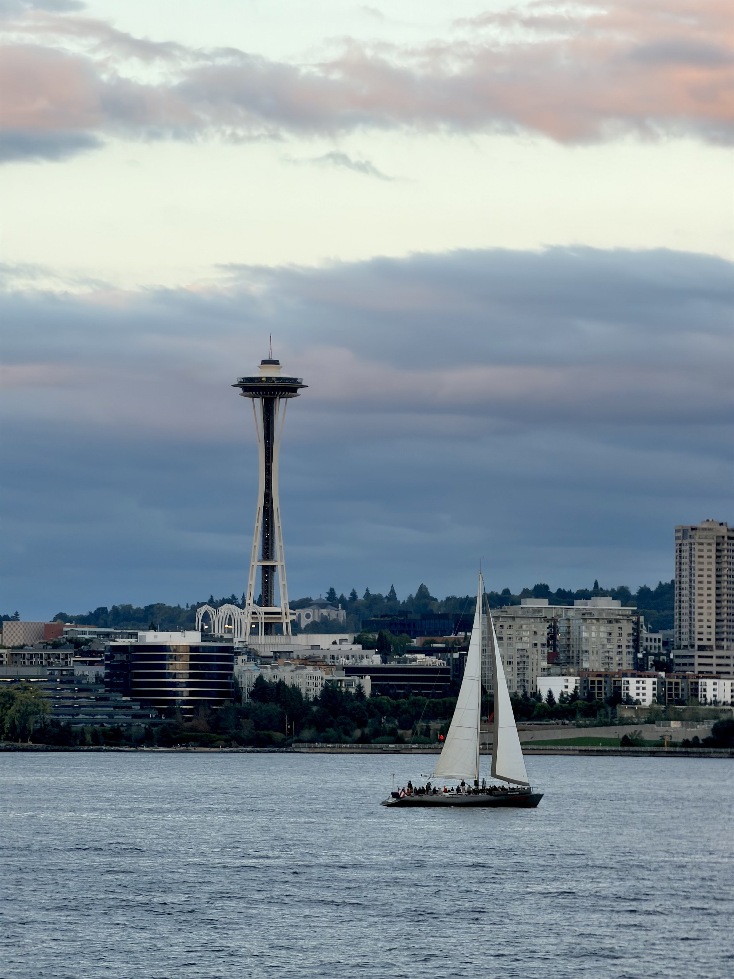  Caught a moment when a sailboat passed by a nice view of the Space Needle in the harbor at Seattle, Washington 