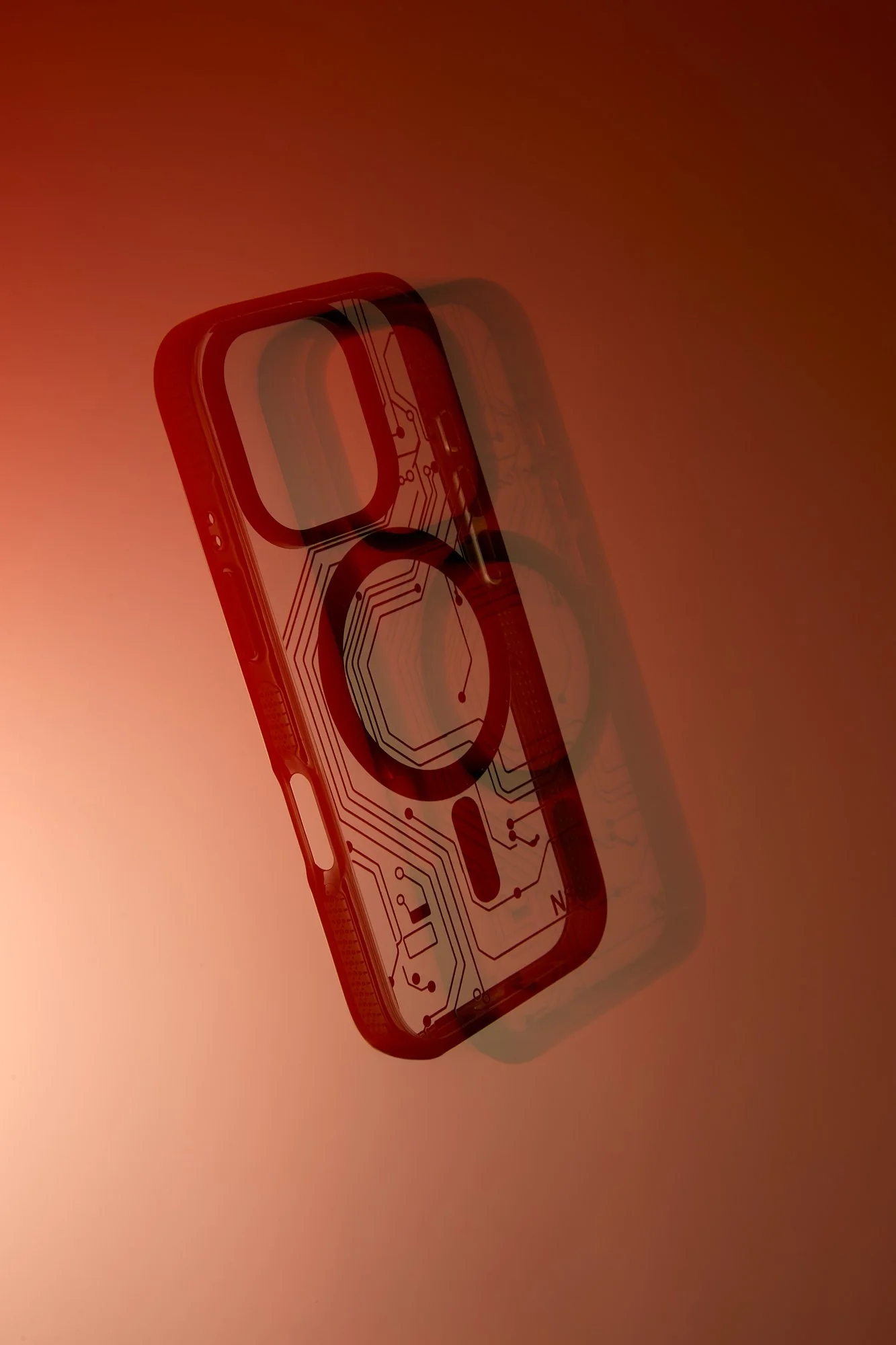 A circuit board design overlay on a smartphone, with a gradient reddish background.