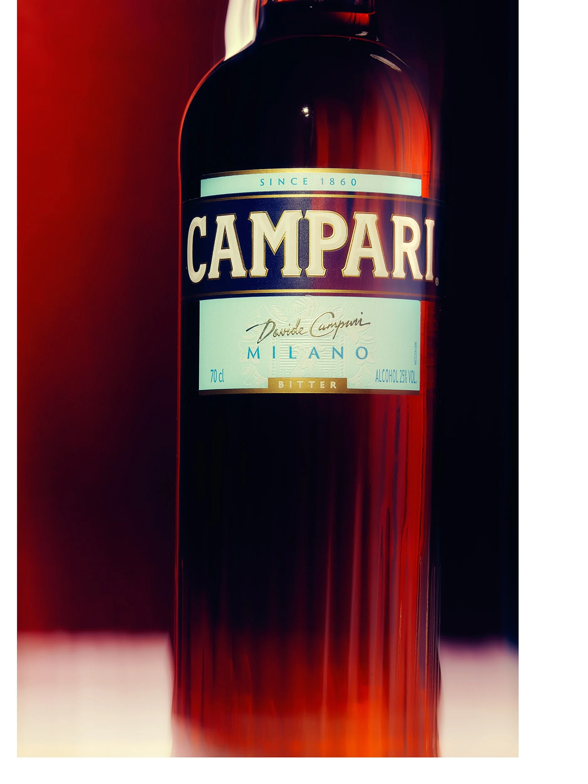 Beverage photography, a bottle of Campari Milano bitters with a dark red liquid