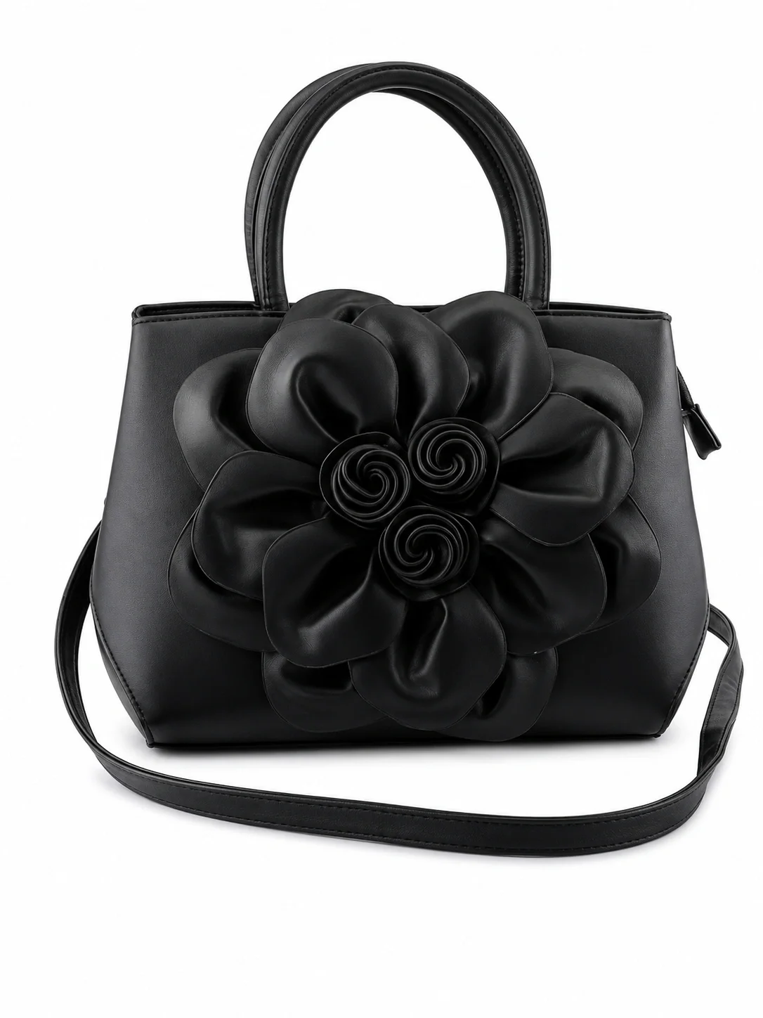 Black handbag with large flower decoration on the front
