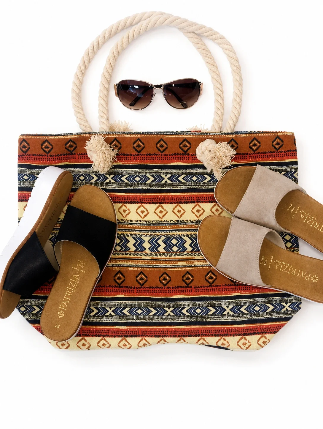 aztec beach style bag, brown and blcak sandals and sunglasses