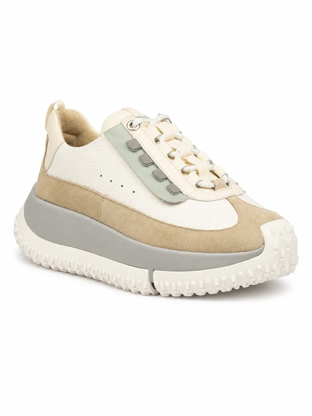 Kapok Pinto sneaker features a distinctive thick platform sole with spiked rubber outsoles for traction
